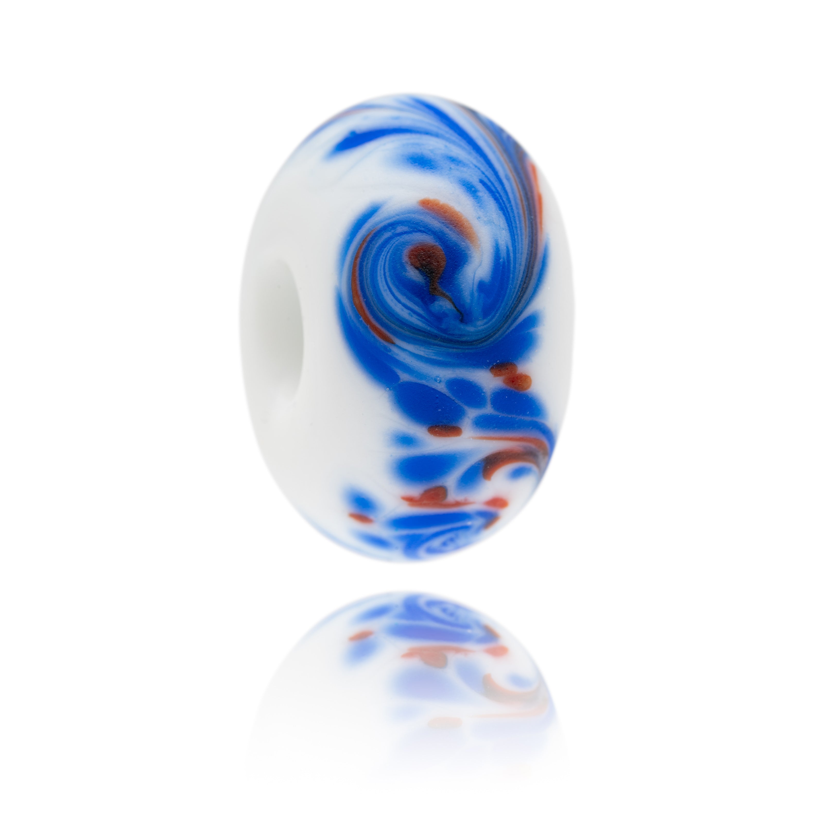 White glass bead with swirling red and blue patterns on surface representing Botany Bay in Kent.