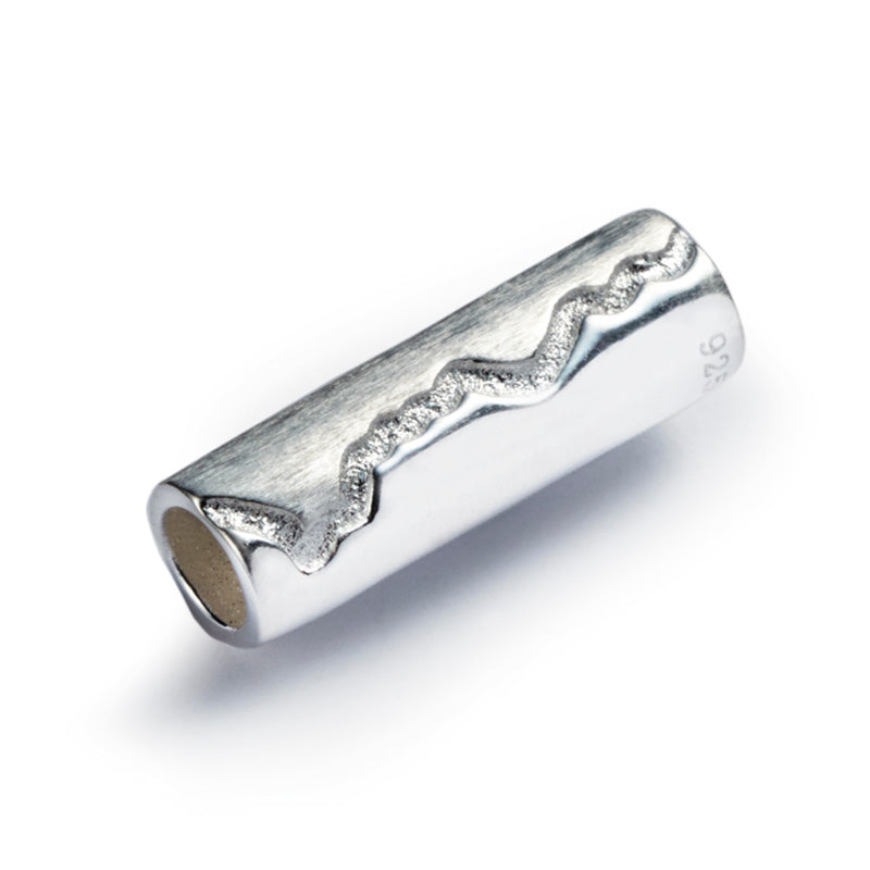 Silver tube shaped bead with the  Cornish Coastline county engraved on the surface.