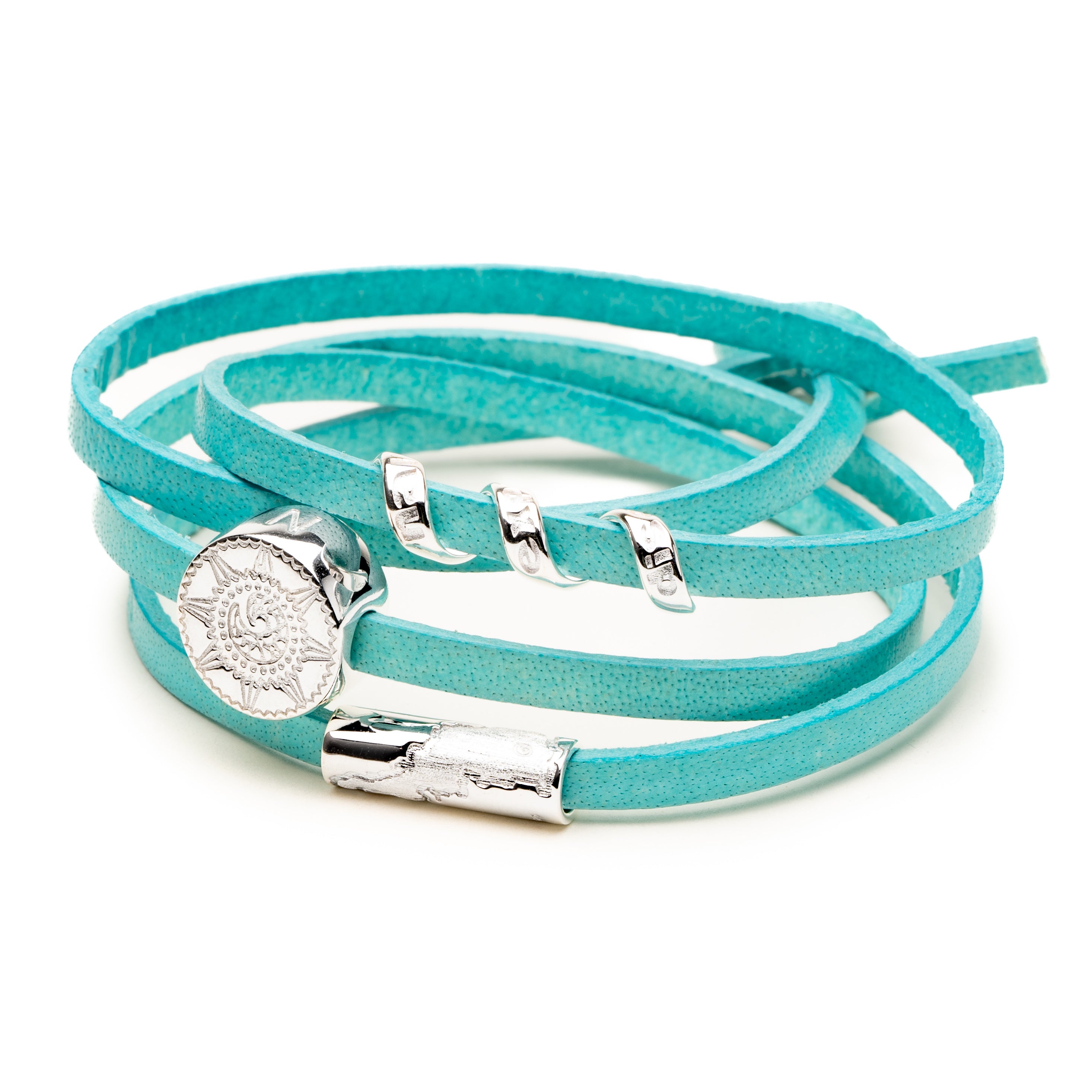 Turquoise leather bracelet with silver Cornish charms.
