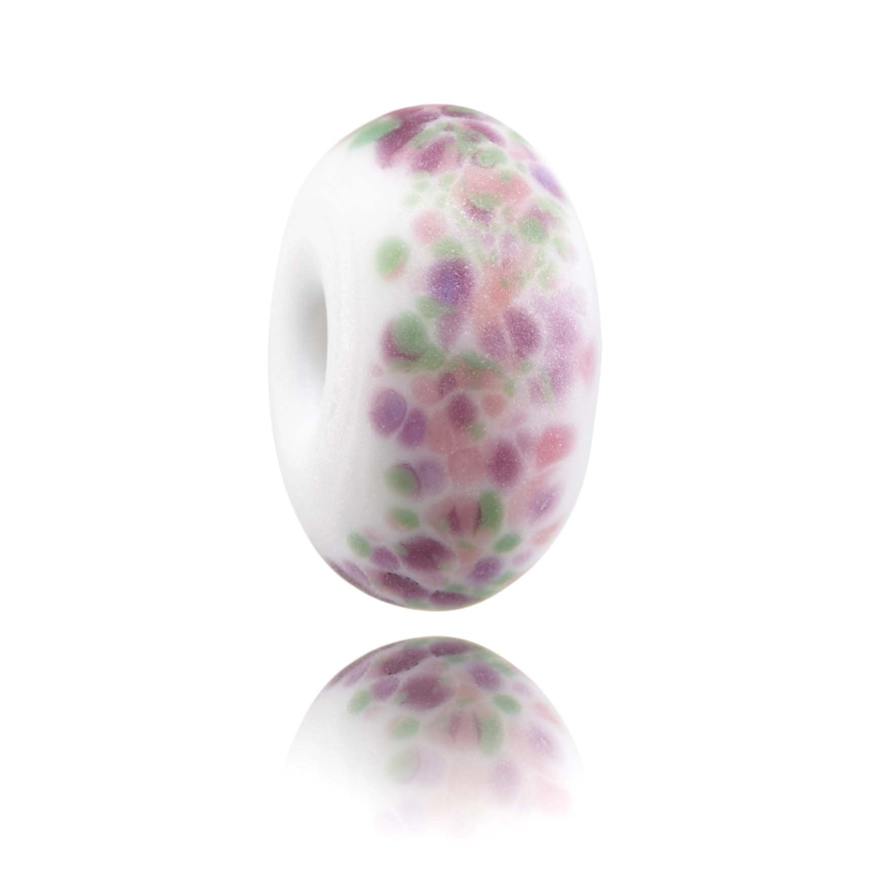 White glass bead with green, pink, purple with frosted texture finish.