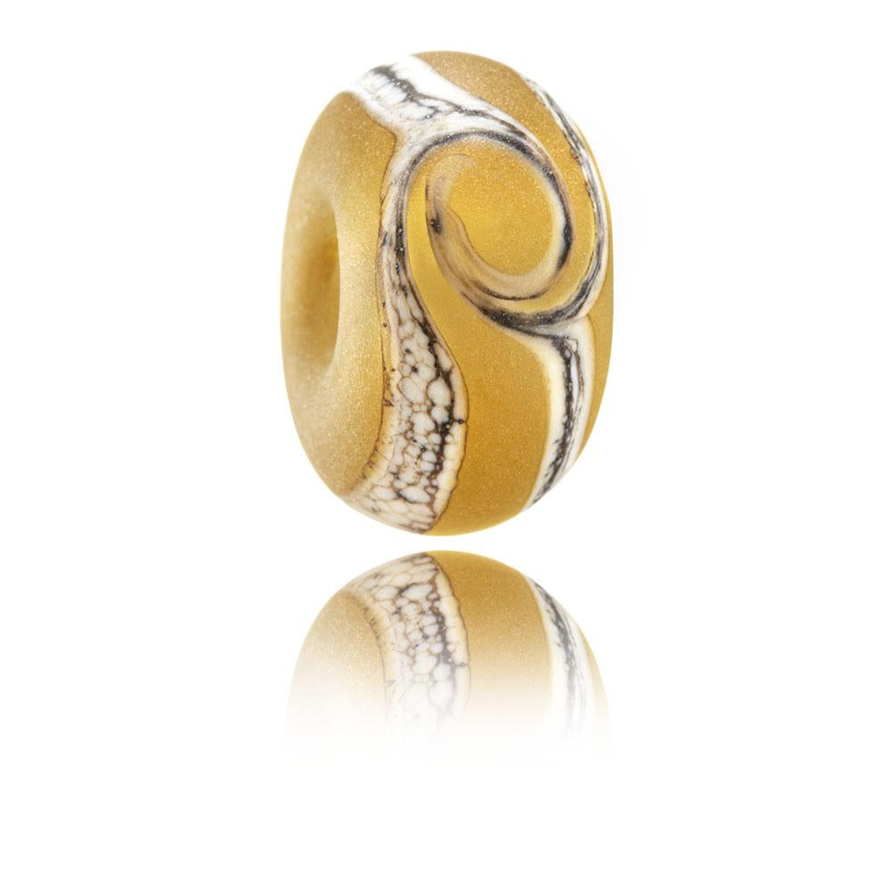 Amber glass bead with cream and brown swirl in centre with frosted sea glass finish, representing Crow Point in North Devon.
