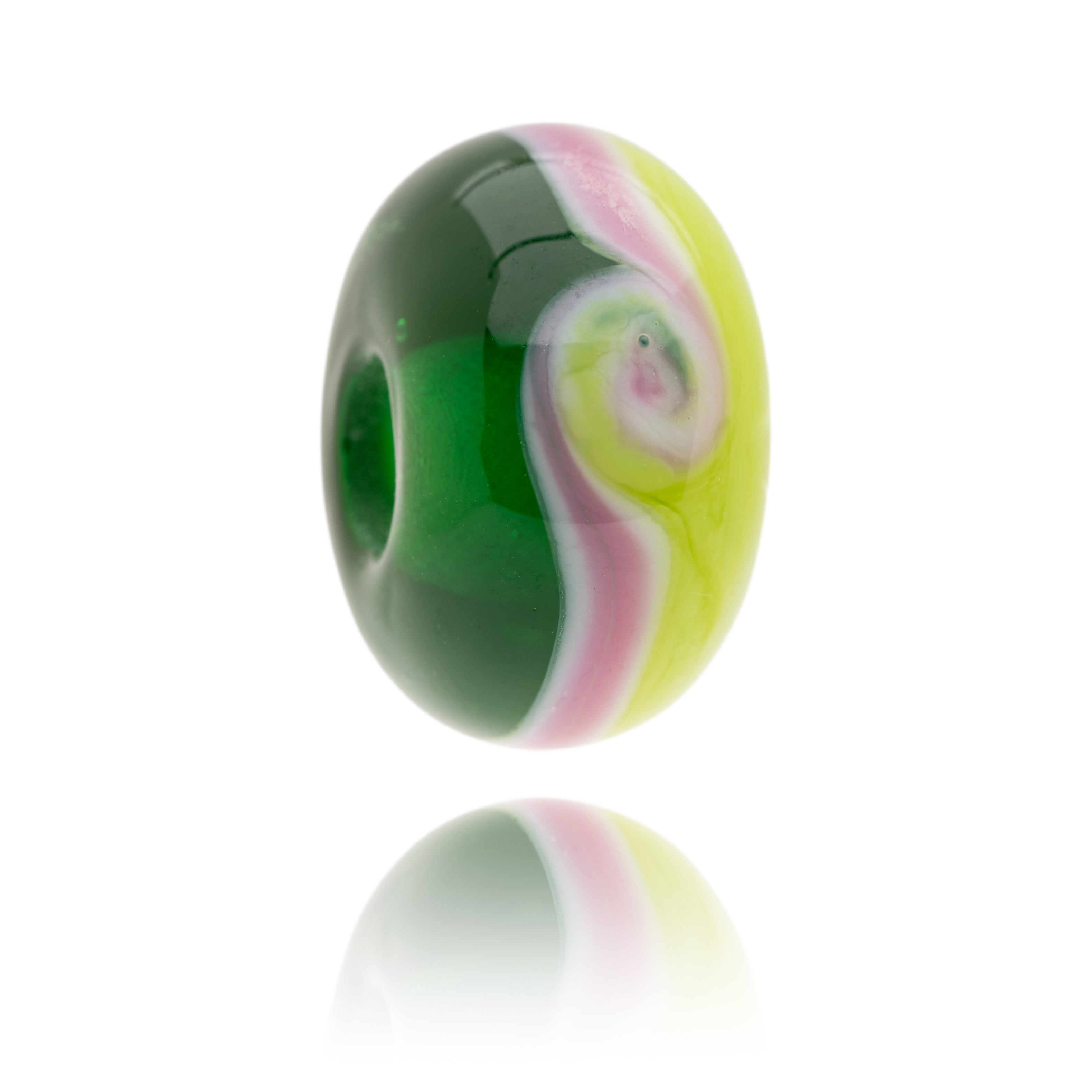 Green and pink glass bead made in North Devon for Children's Hospice South West.