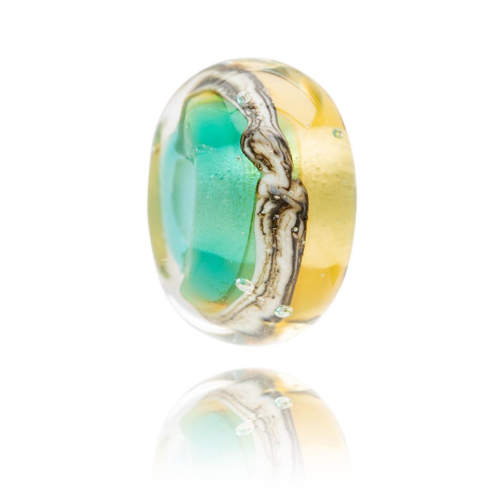 Teal and amber watery glass bead with sand soil stripe around the middle designed for Cromer in Norfolk.