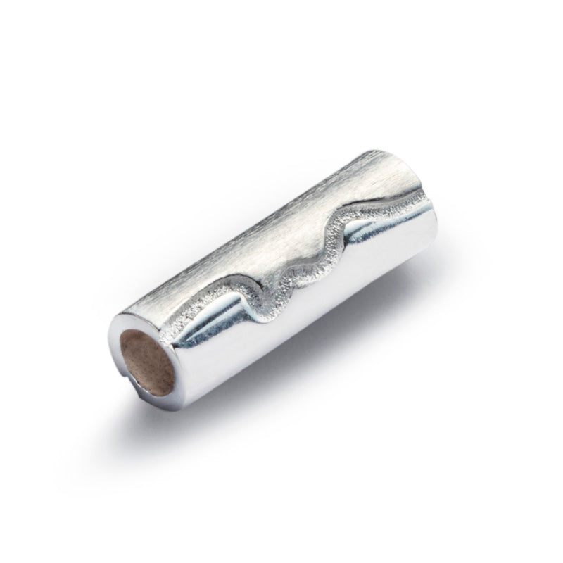 Silver tube shaped bead with the North Devon Coastline county engraved on the surface.