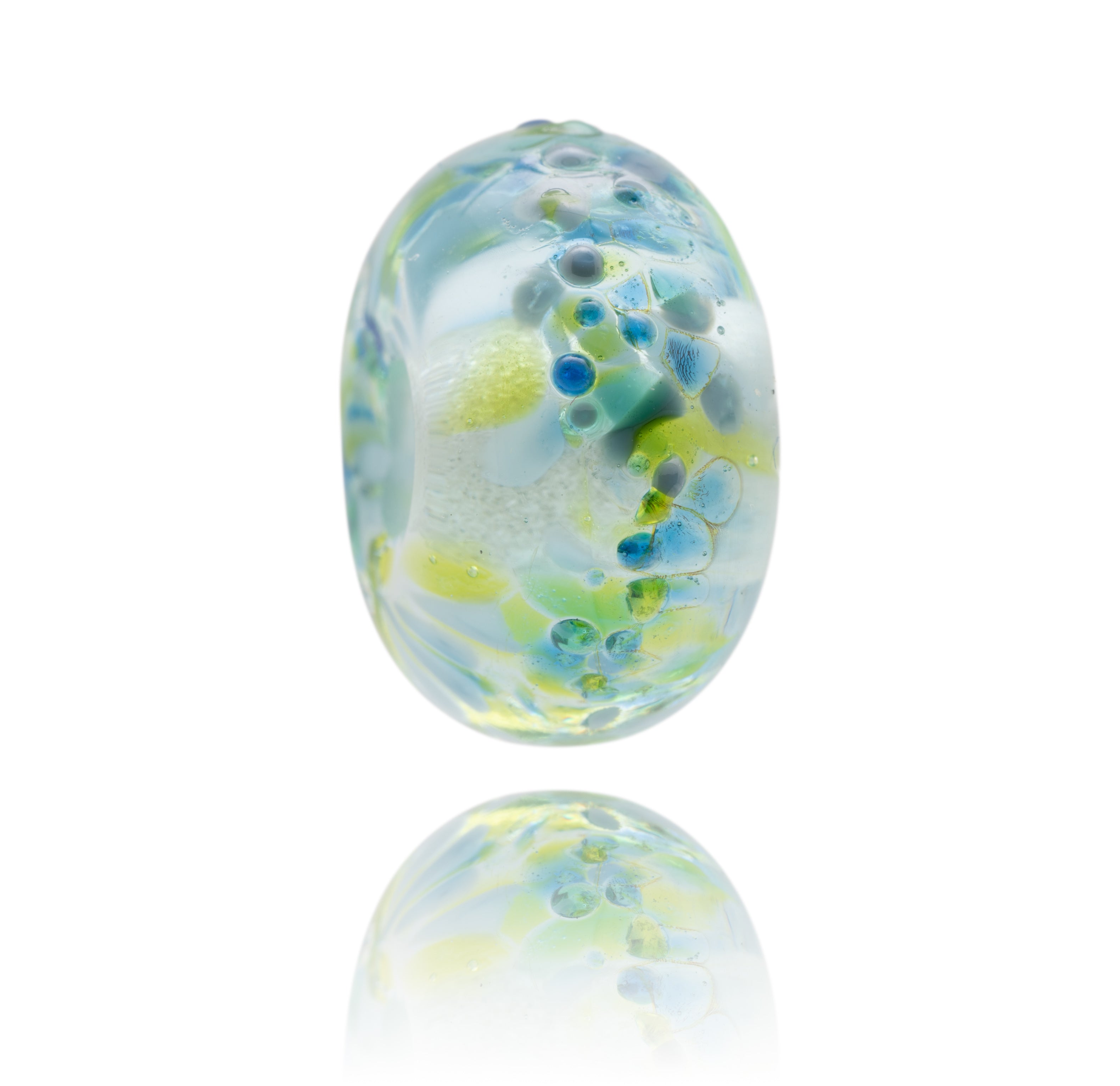 Clear, blue, green Murano glass lamp work bead representing Daymer Bay in Cornwall.