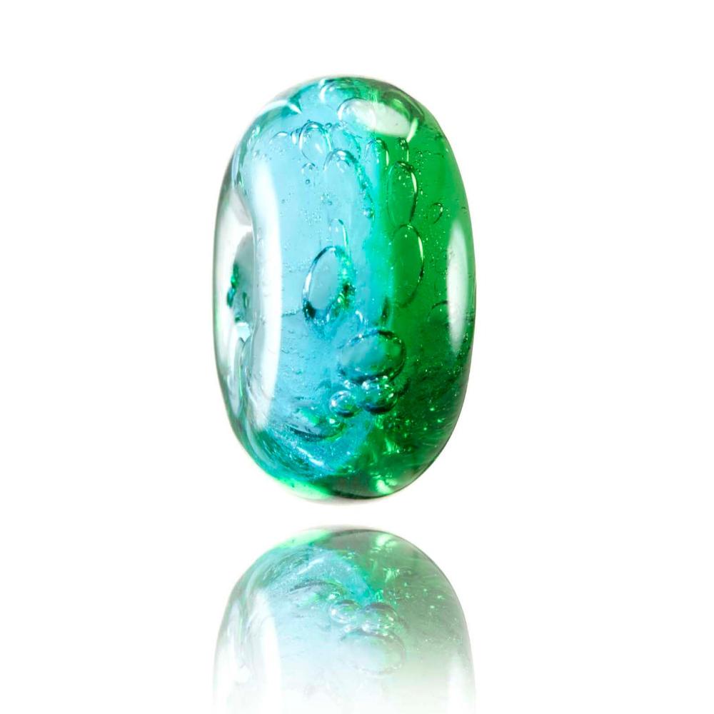 Blue and green transparent glass bead representing Hot Water Beach in New Zealand.