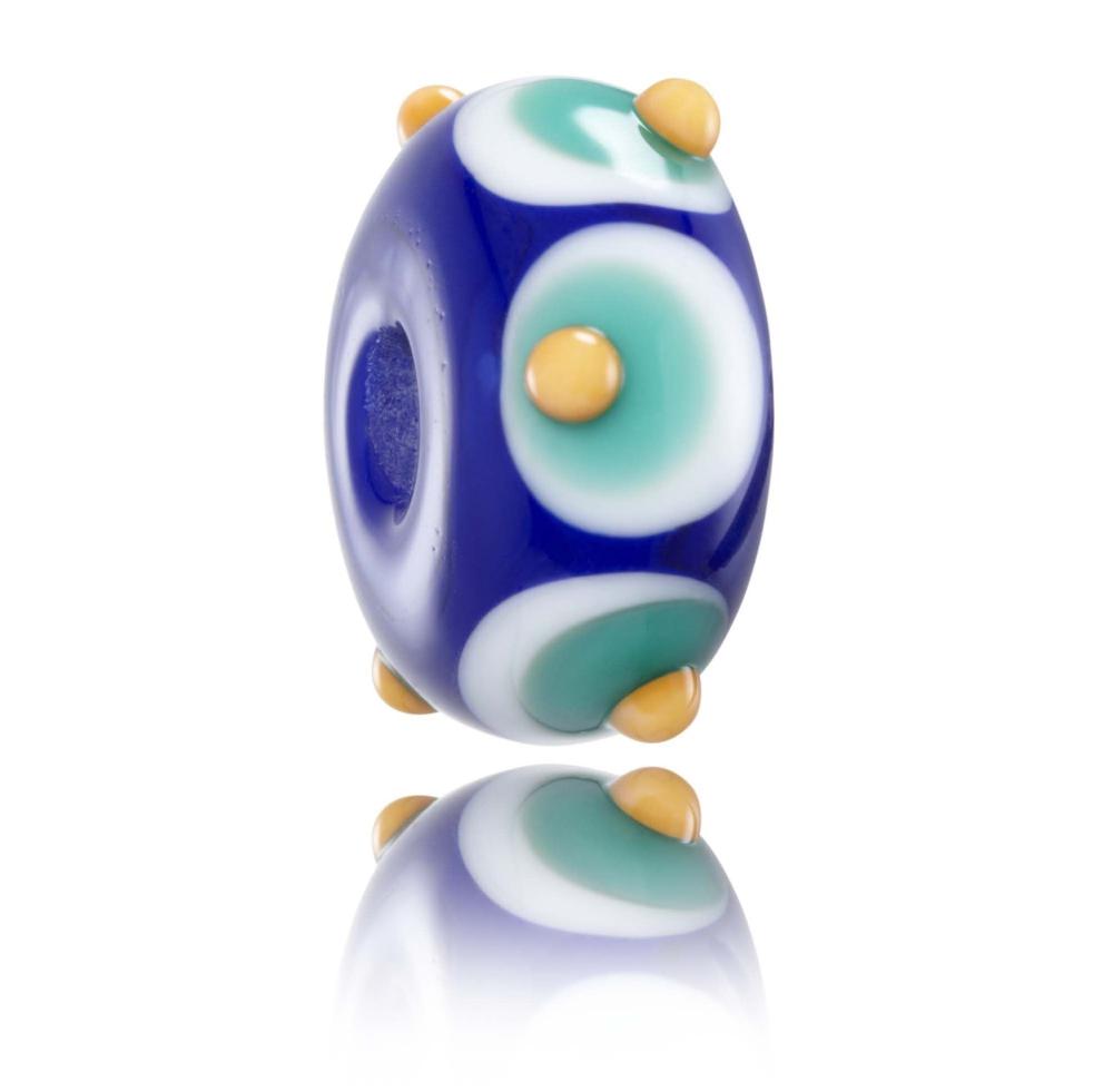 Bright blue glass bead with white, green and orange dots layered on top of each other. Designed for Lennox Heads beach in Australia.