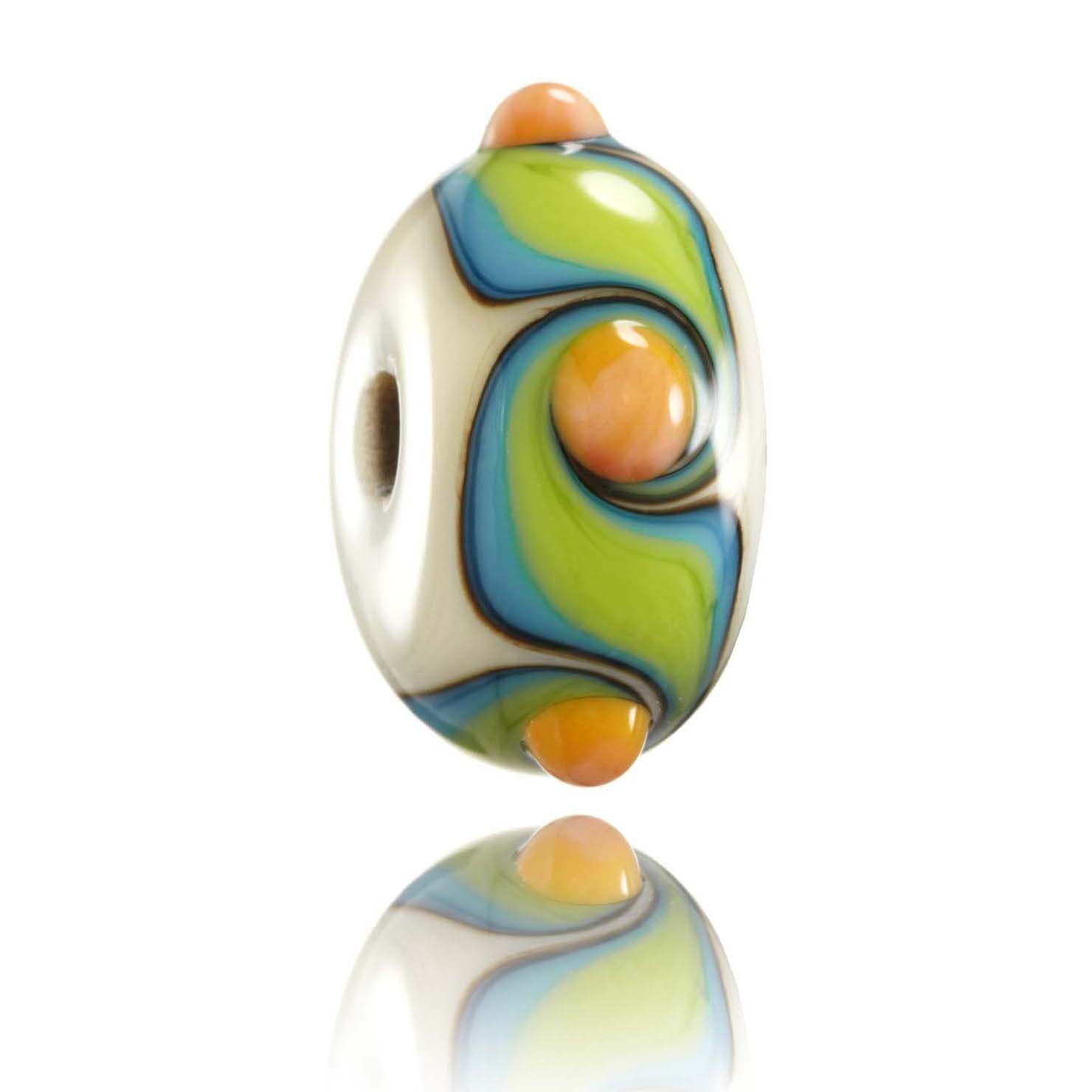 Cream glass bead with turquoise, green and orange glass patterns  on the surface. Representing the Island of Nusa Lembongan in Indonesia.