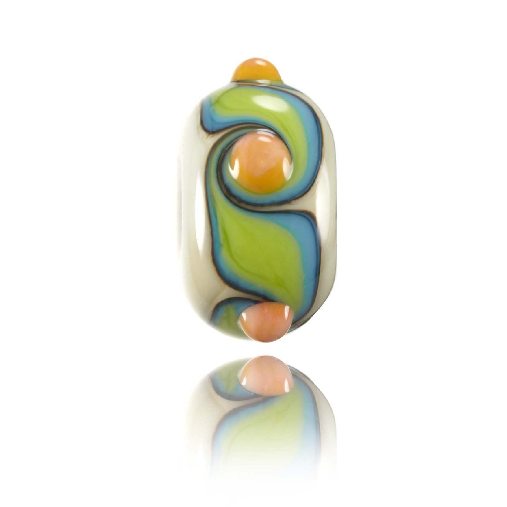 Cream glass bead with turquoise, green and orange glass patterns  on the surface. Representing the Island of Nusa Lembongan in Indonesia.