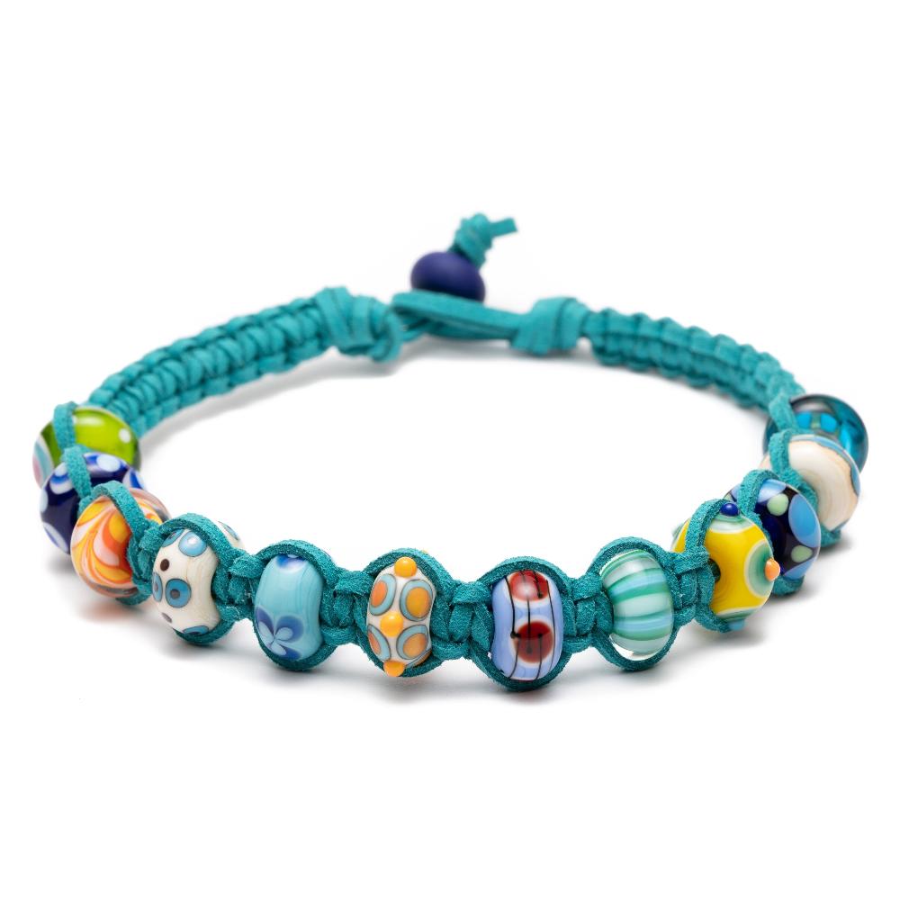 Colourful handmade murano glass beads that represent travel destinations and beaches from across the world made up onto a vegan suede cord choker necklace in a teal color.