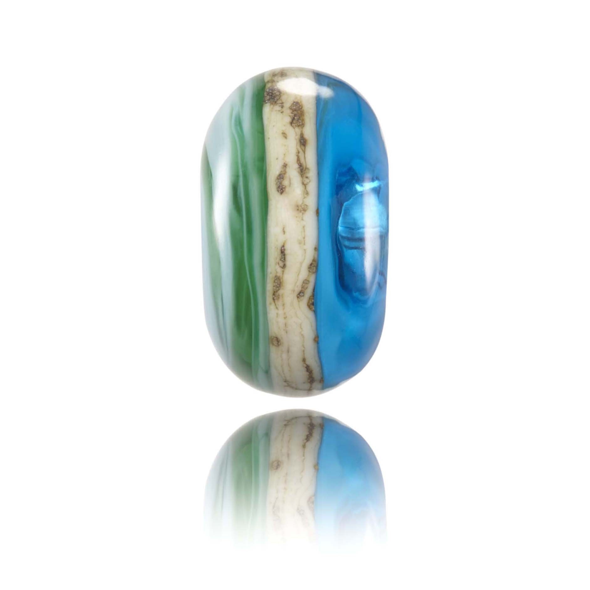 Green and blue glass bead with a sandy stripe around the middle. Representing Padstow in Cornwall, UK.