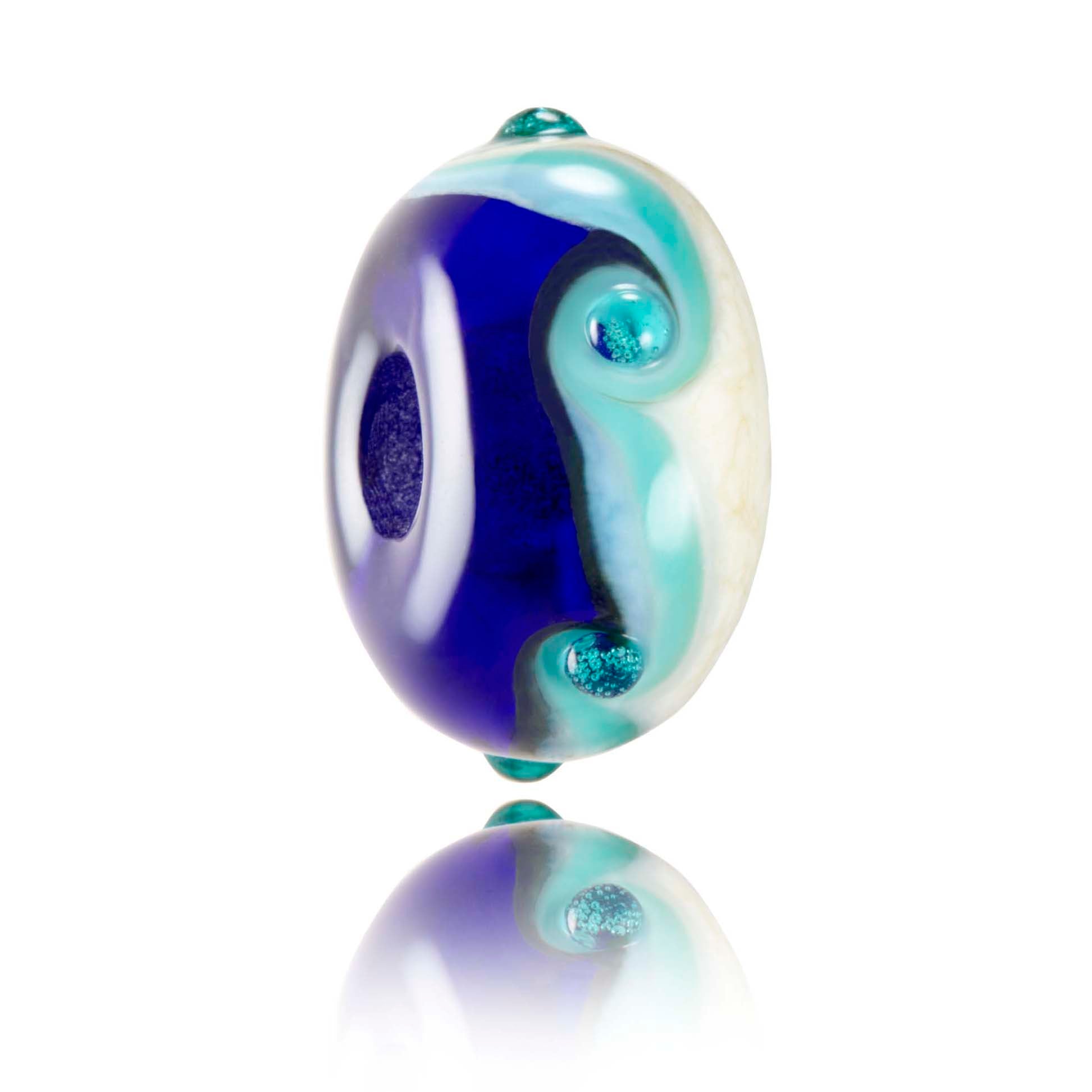 Ocean Generation glass charity bead in shades of blue and cream coloured glass.