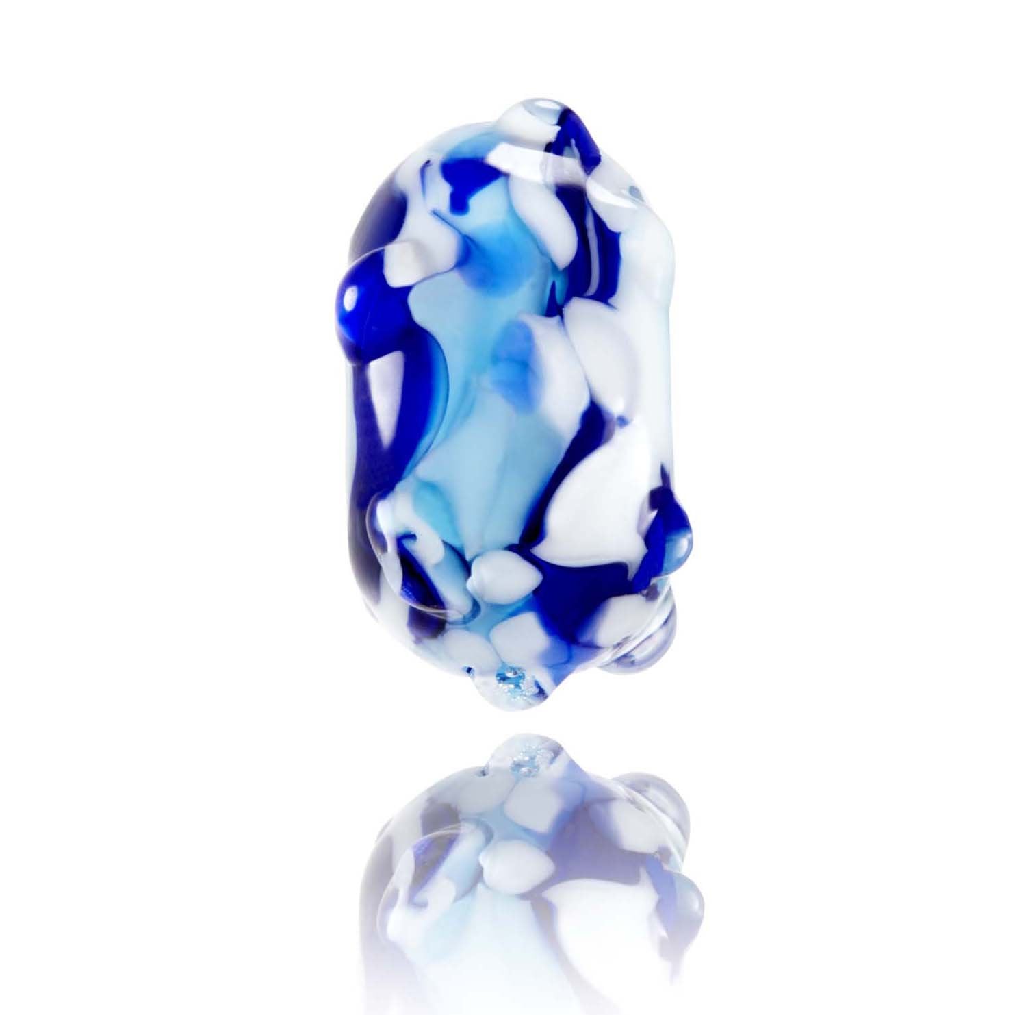 Swirling blue and white glass bead with clear raised dots on the surface, representing Porthcothan in Cornwall.