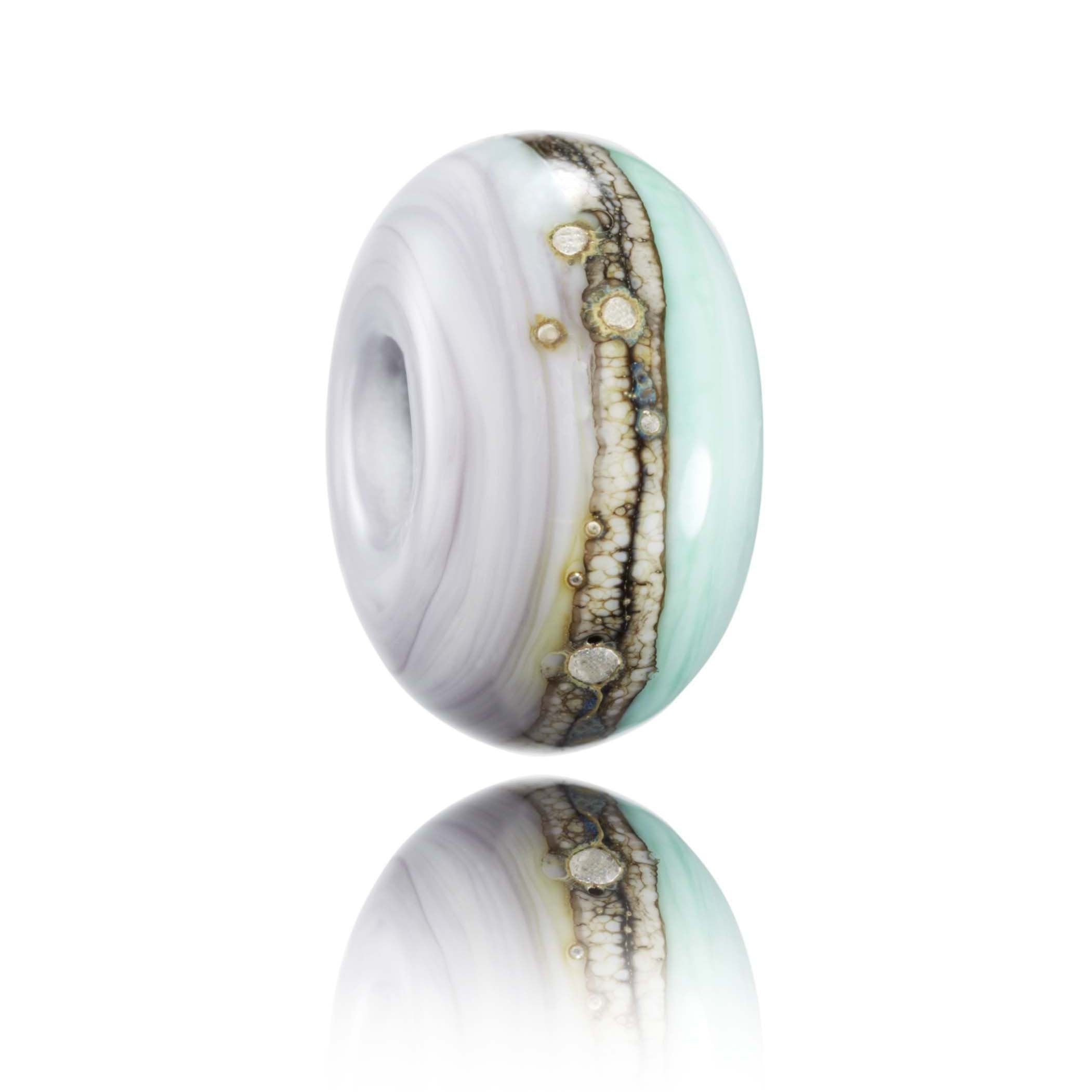 Purple and green glass bead for Porth Beach in Newquay.