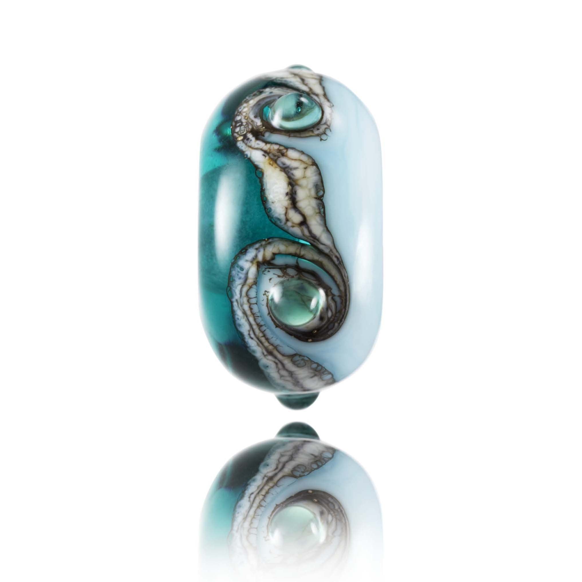 Teal and light blue glass bead with swirls and dots around the middle. Representing Port Isaac village in North Cornwall.