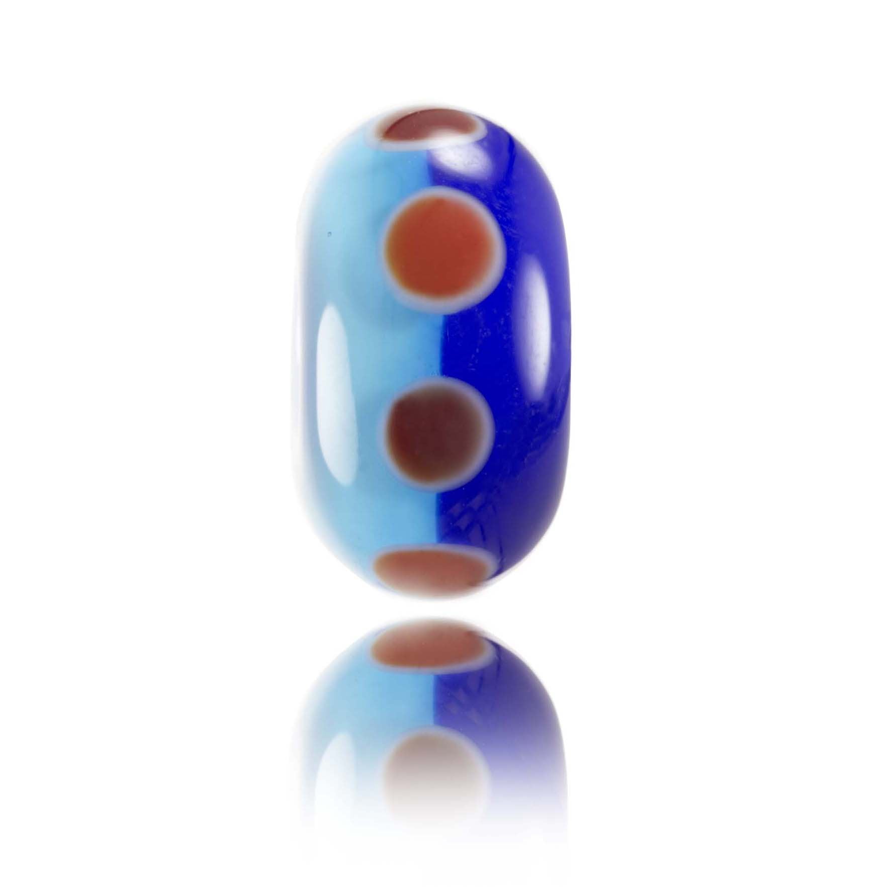 Light and dark blue glass bead with read dots around the middle. Representing Pleasure Point in California, USA.