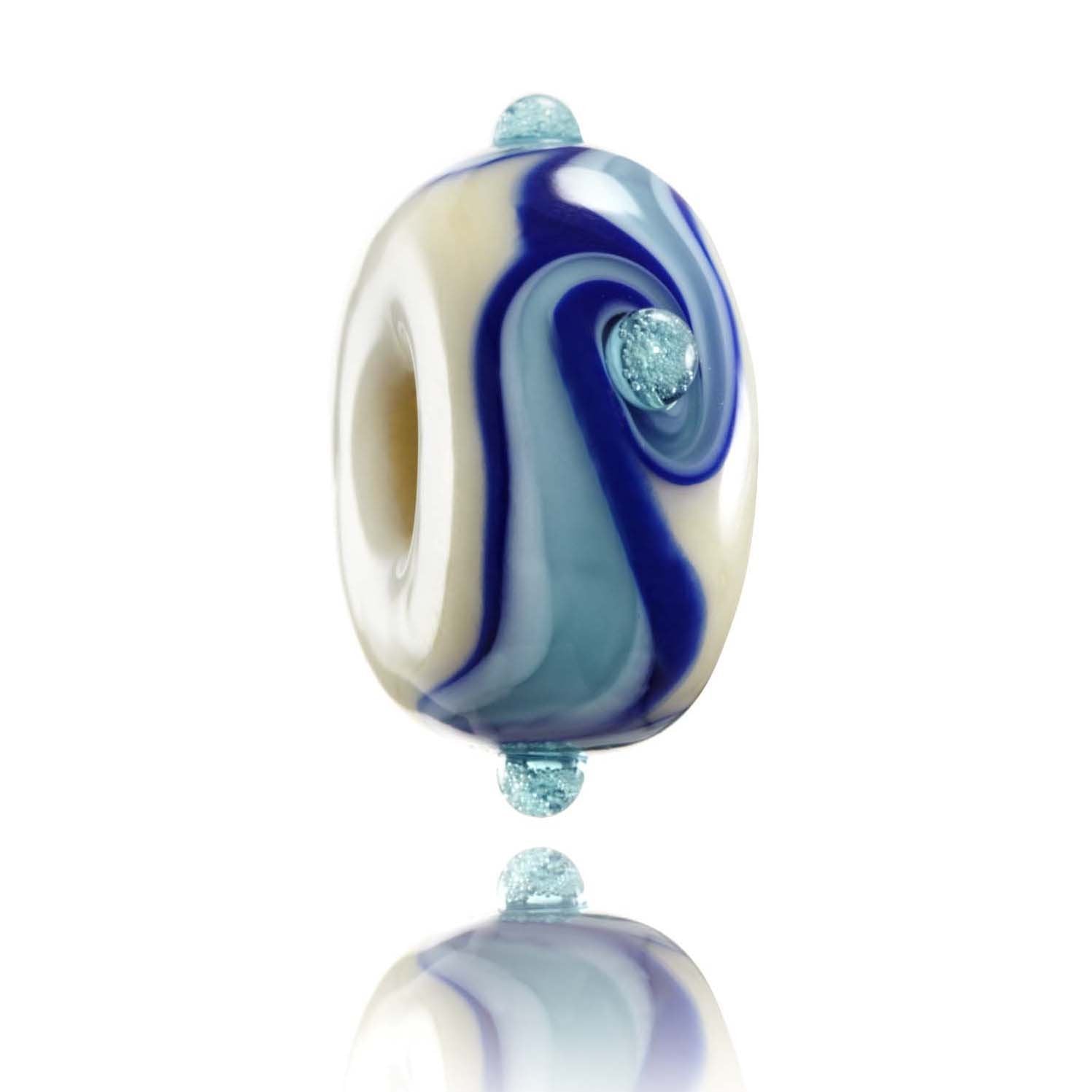 White glass bead with different shades of blue stripes around the centre with small bubble dots on the surface.