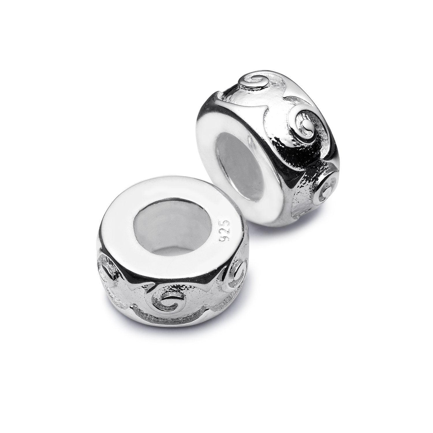 Silver stopper beads with swirling engraving around the beads.