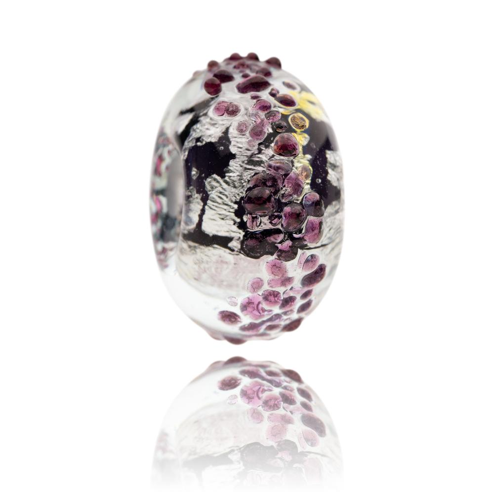Purple and silver glass bead for the Isle Of South Uist in Scotland.