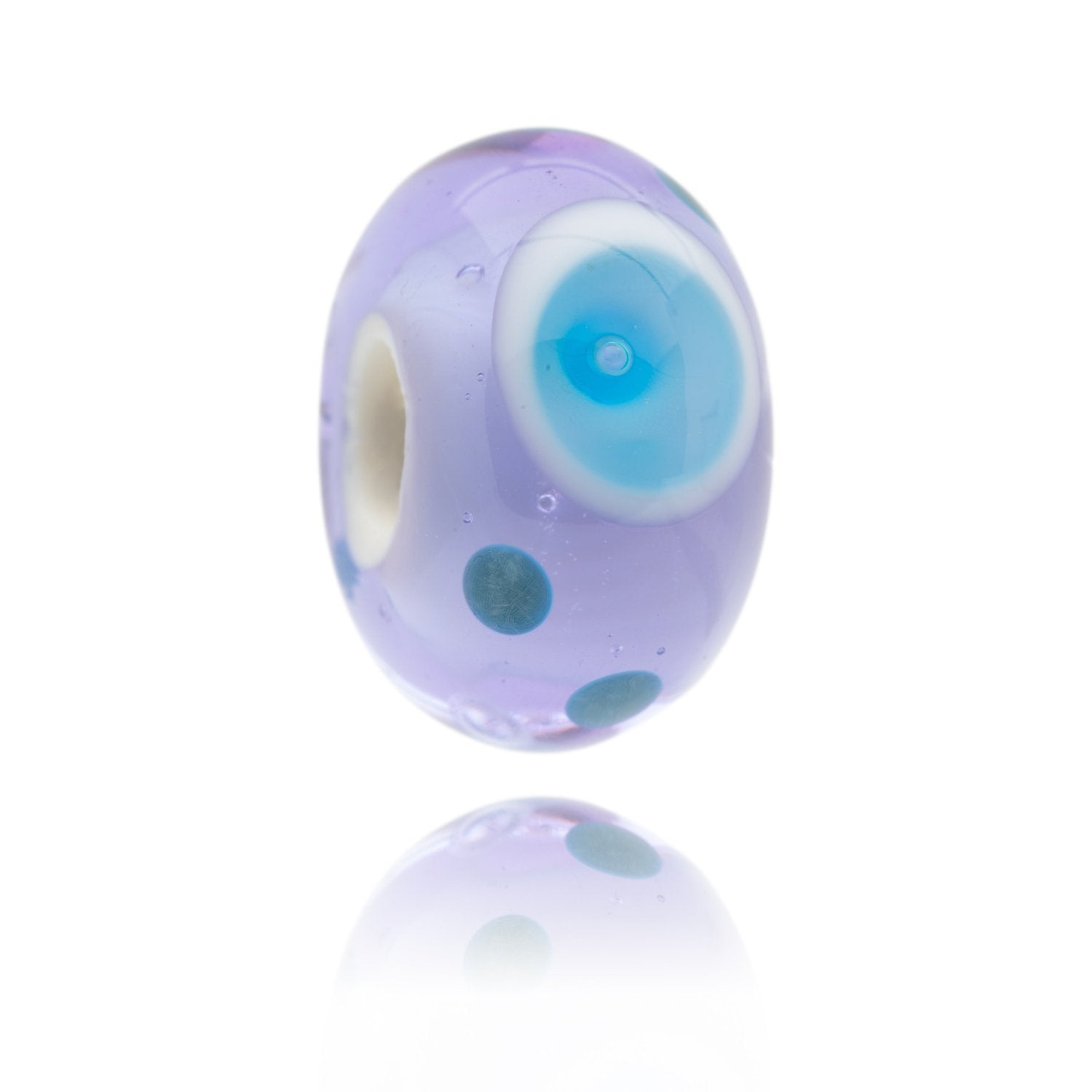 Lavender glass bead with blue bubble pattern on the surface, representing St Michaels Mount in Cornwall.