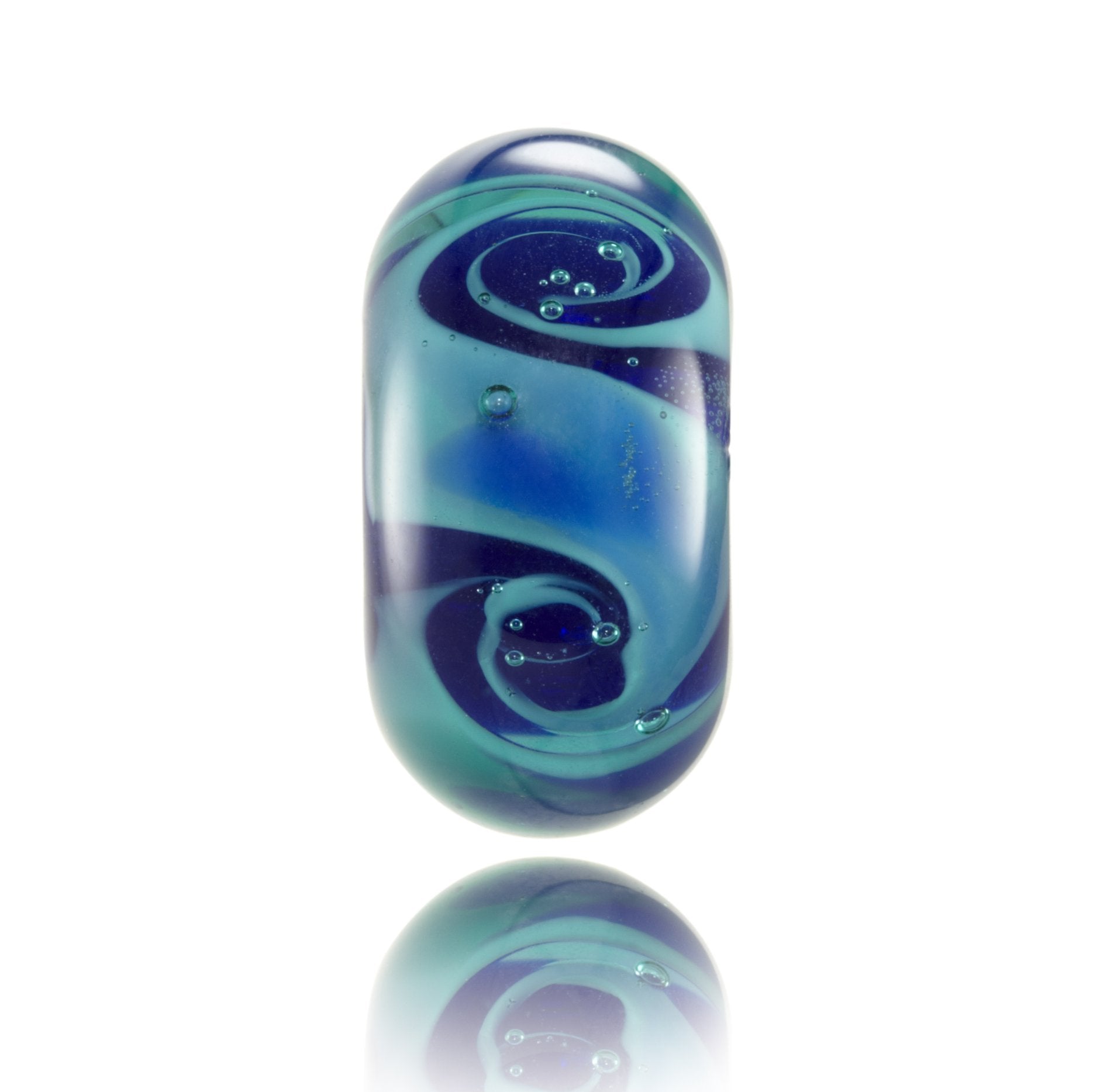 Teal and dark blue swirling glass bead inspired by the deep ocean seas of the Atlantic.