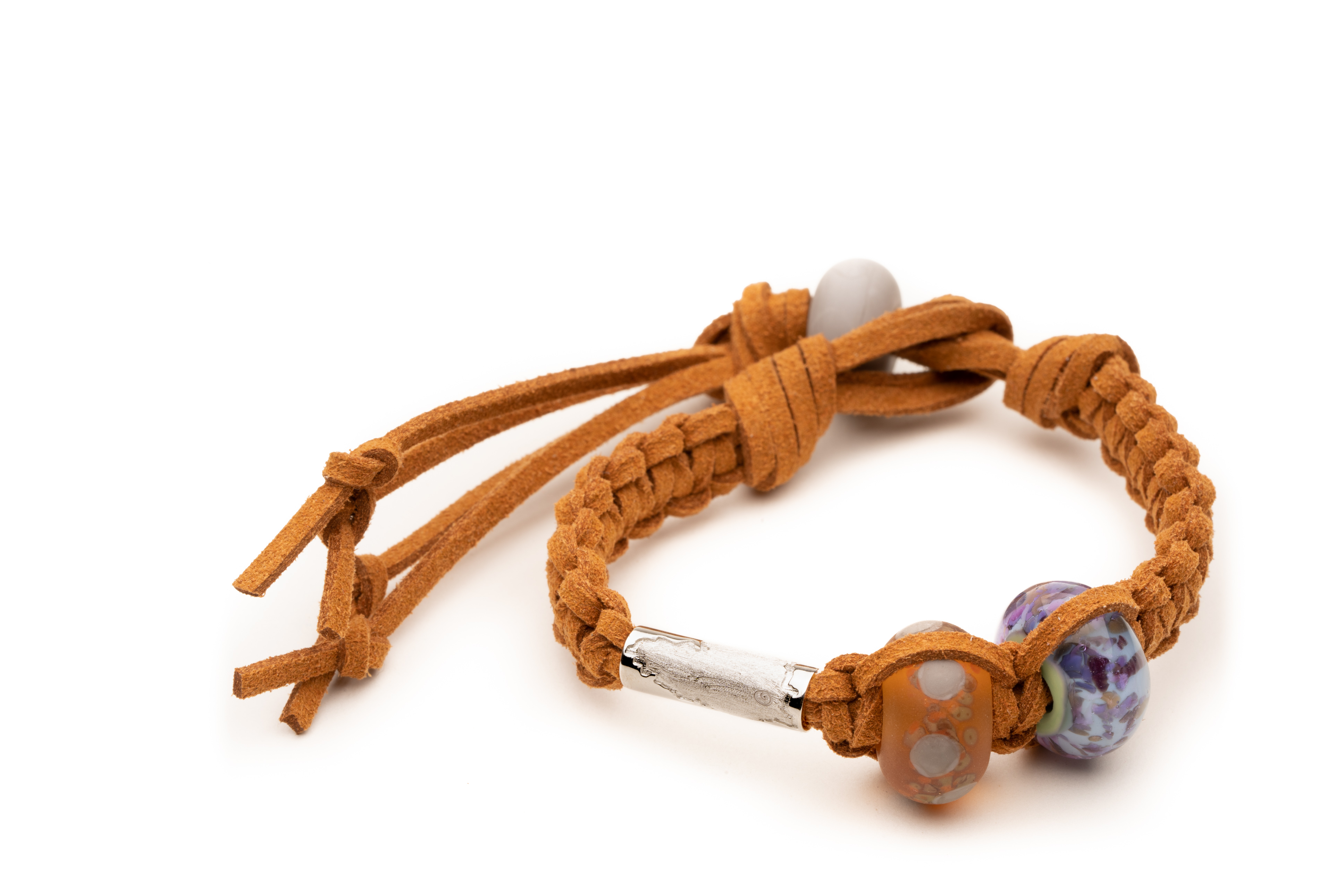 Tan cord Nalu bracelet with a silver Devon county charm, Dartmoor and Exmoor glass beads.