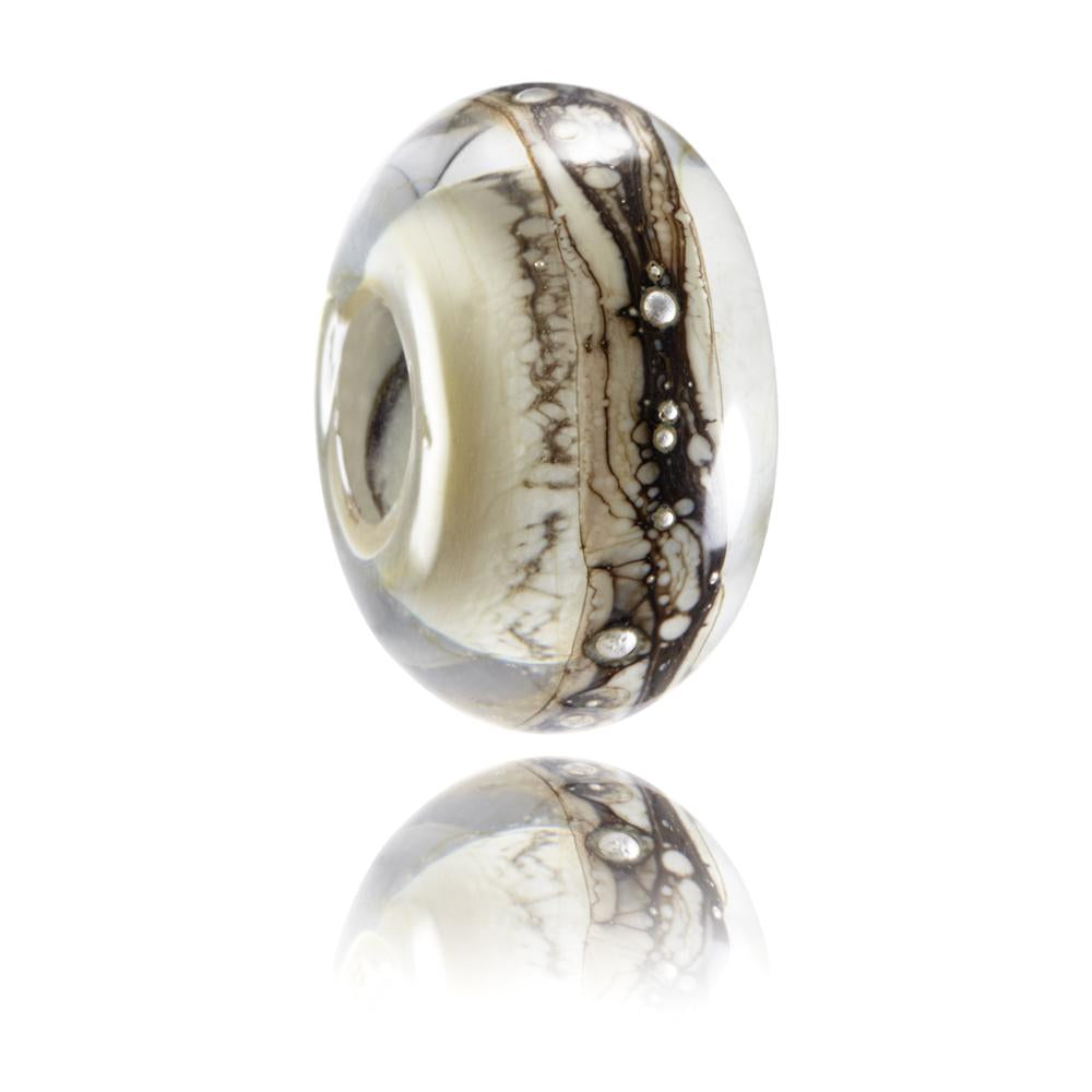 Cream, brown and grey glass bead with silver droplets on the surface. Representing Ilfracombe in North Devon.
