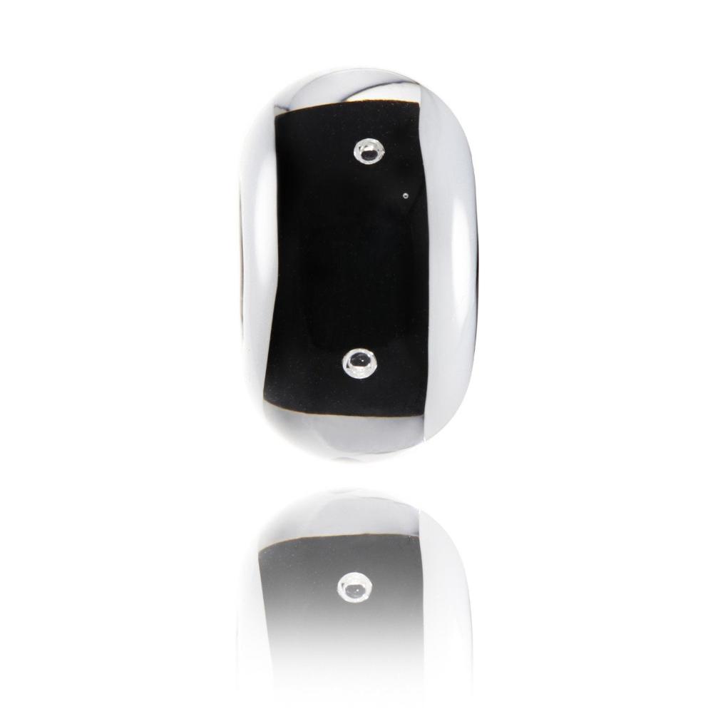 Glass bead with a black core and clear glass encasing it with white stripes down each side and little bubbles within the bead, representing Mammoth Mountain in theUSA.