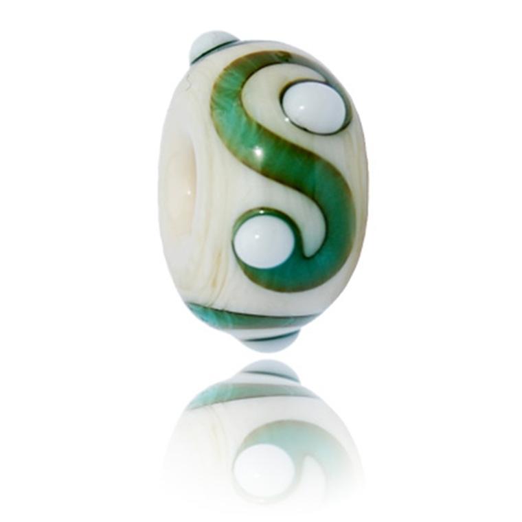 Cream glass bead with green s patterns with raised white dots on the surface. Representing Portrush beach in Northern Ireland.