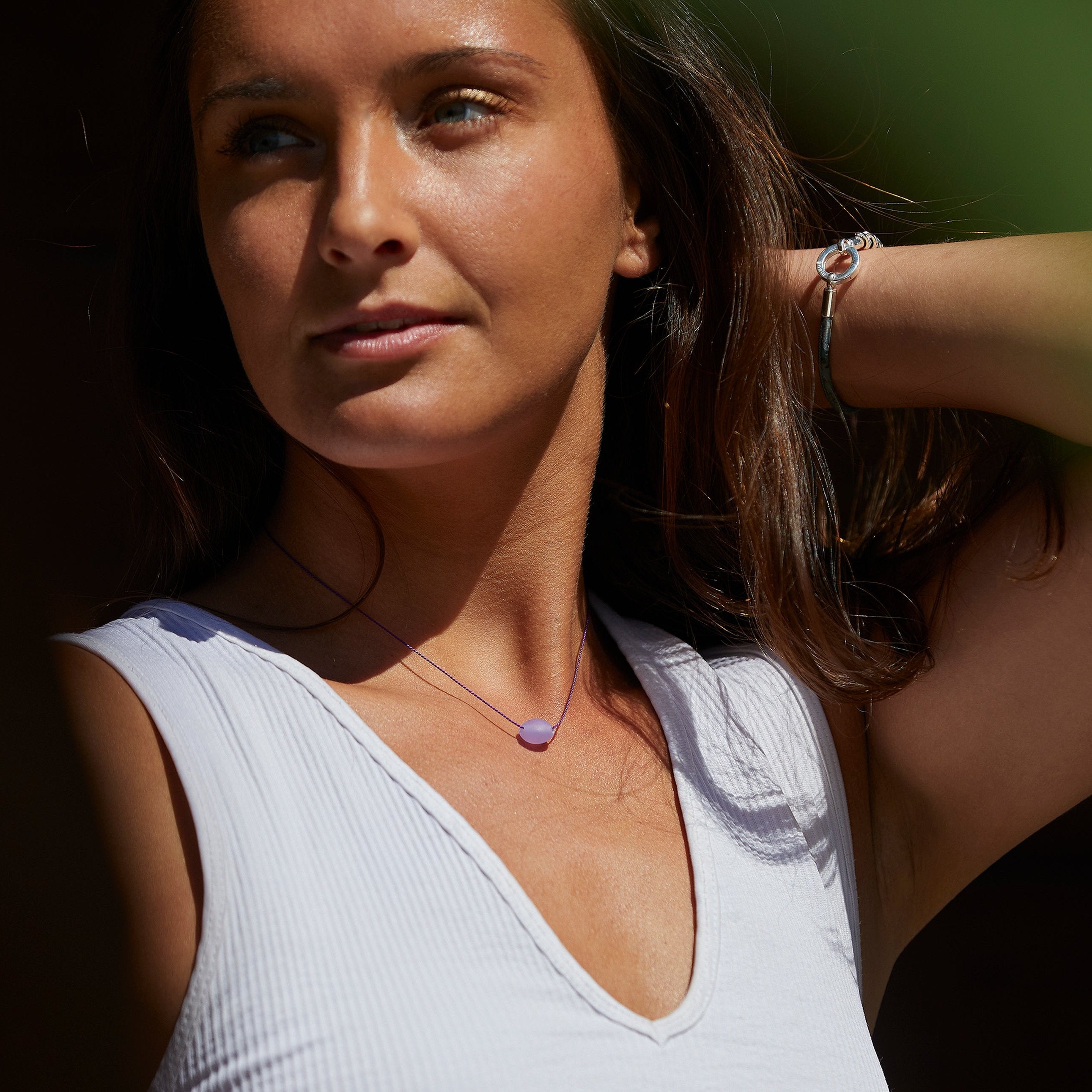 Purple glass pebble necklace and silver and cork teal bracelet.