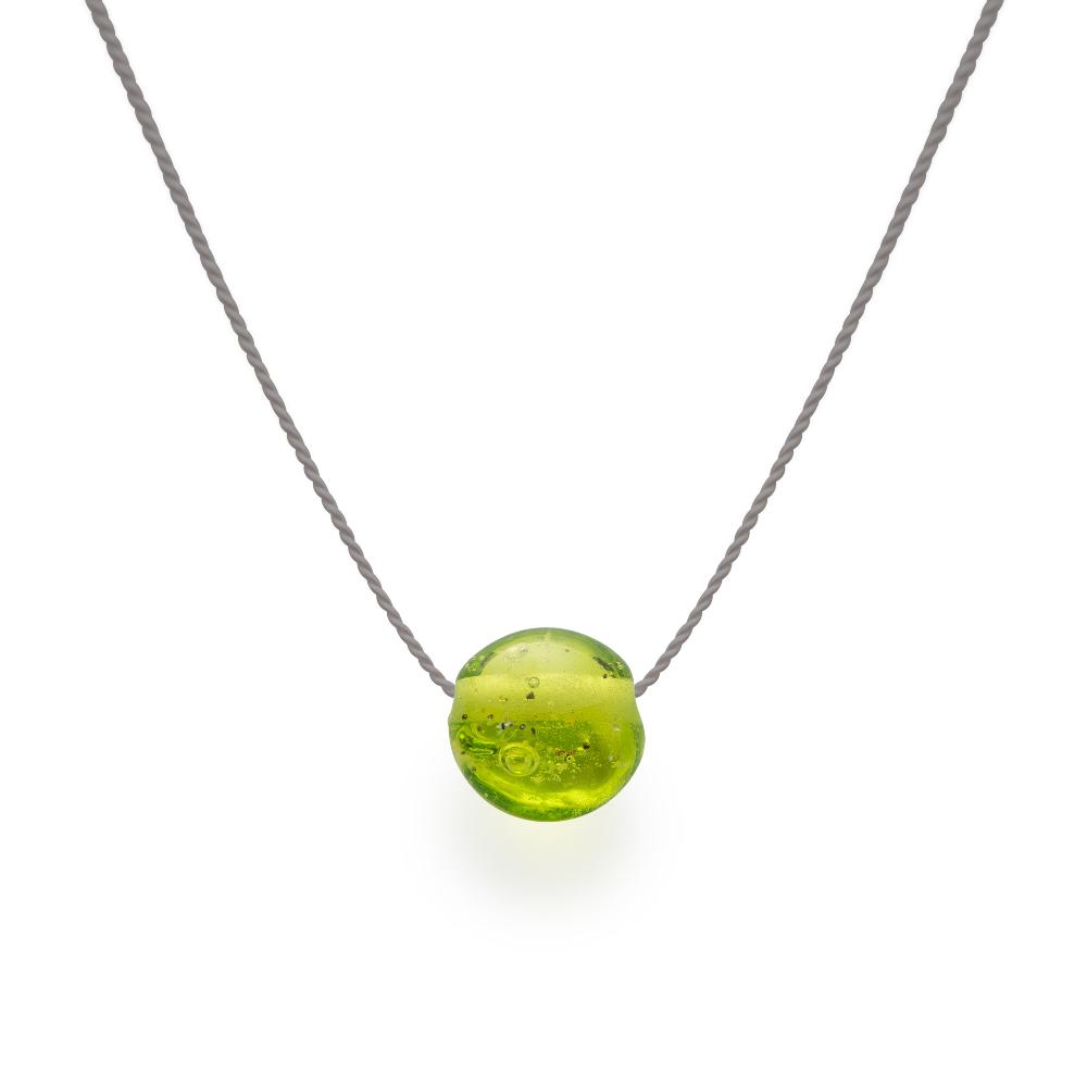 Apple green glass sand bead on silk cord.