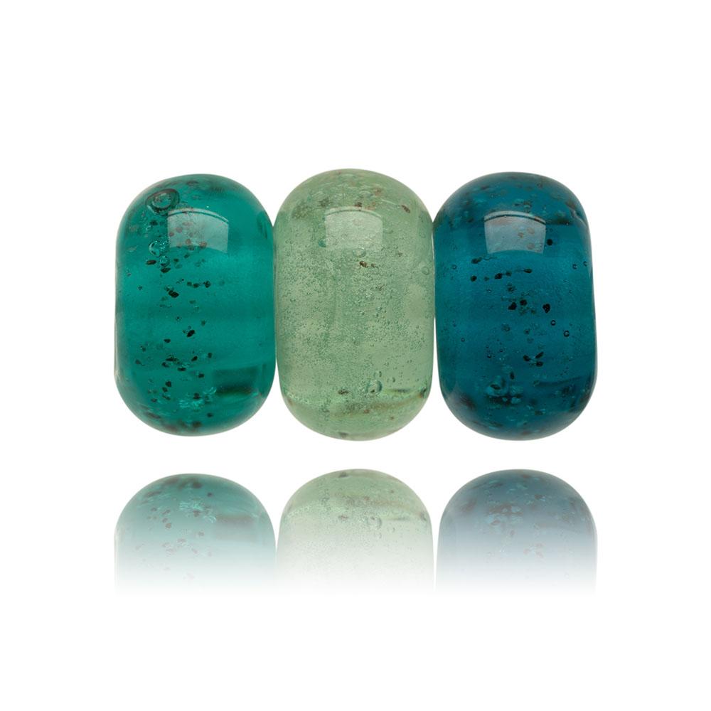 Green trio of glass sand beads with grains of sand in the glass.
