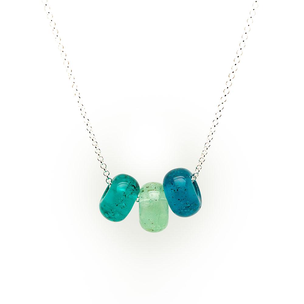 Green trio of glass sand beads with grains of sand in the glass on a silver chain necklace.