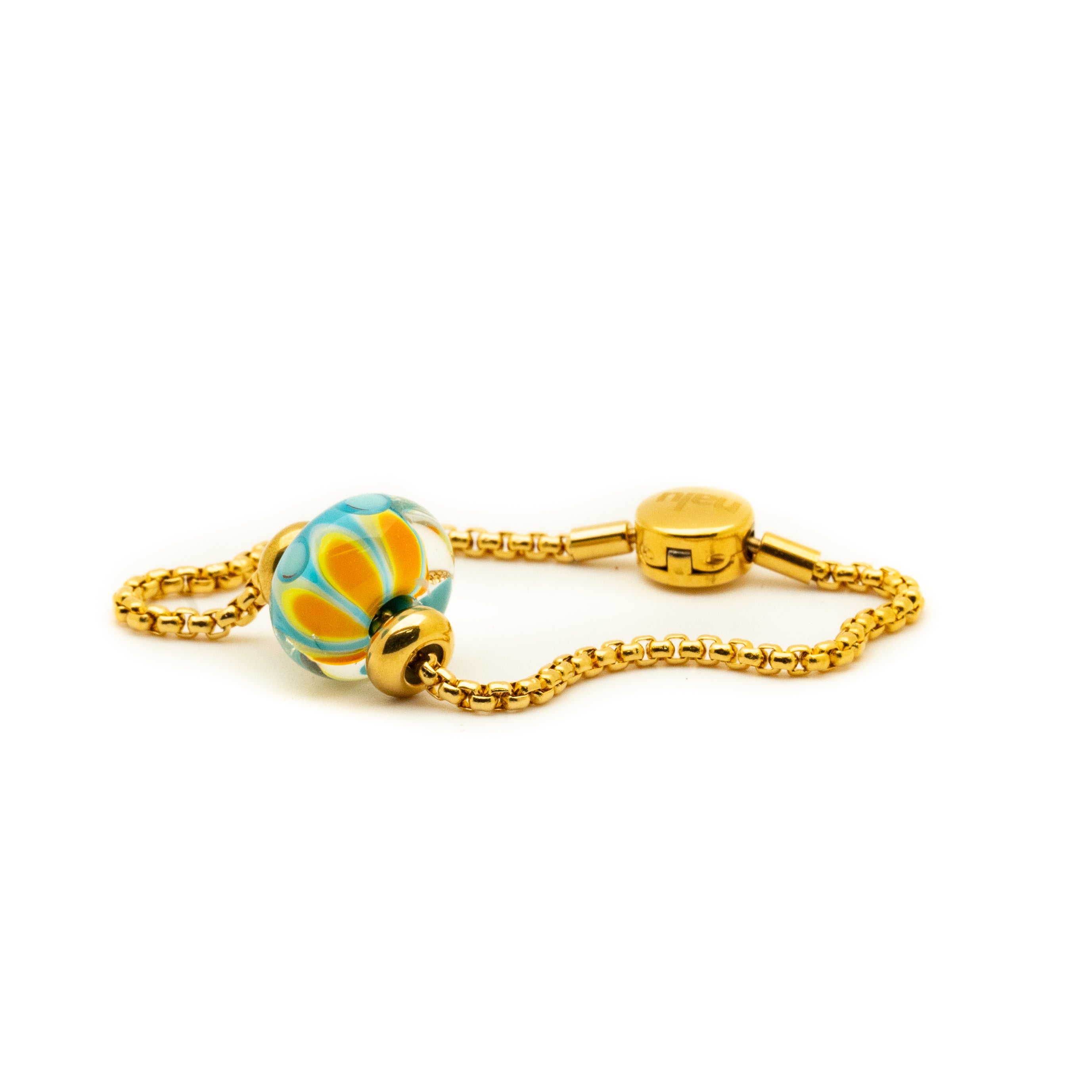 Blue and yellow glass petal bead on a gold bracelet.