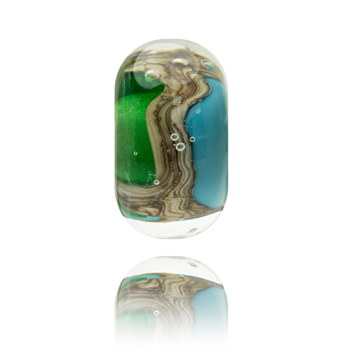 A single clear glass lampwork bead with a rounded rectangular shape, featuring a marbled swirl design of green, teal blue, and brown, with small embedded bubbles, shown on a white background with a soft reflection below.