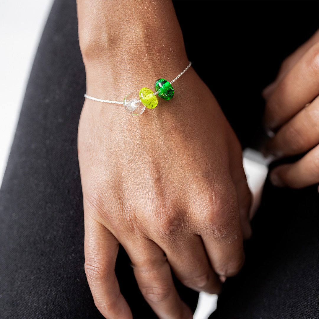 Green Beach Drop bracelet on persons wrist.