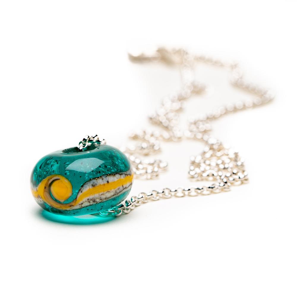 Silver chain necklace with teal glass bead.