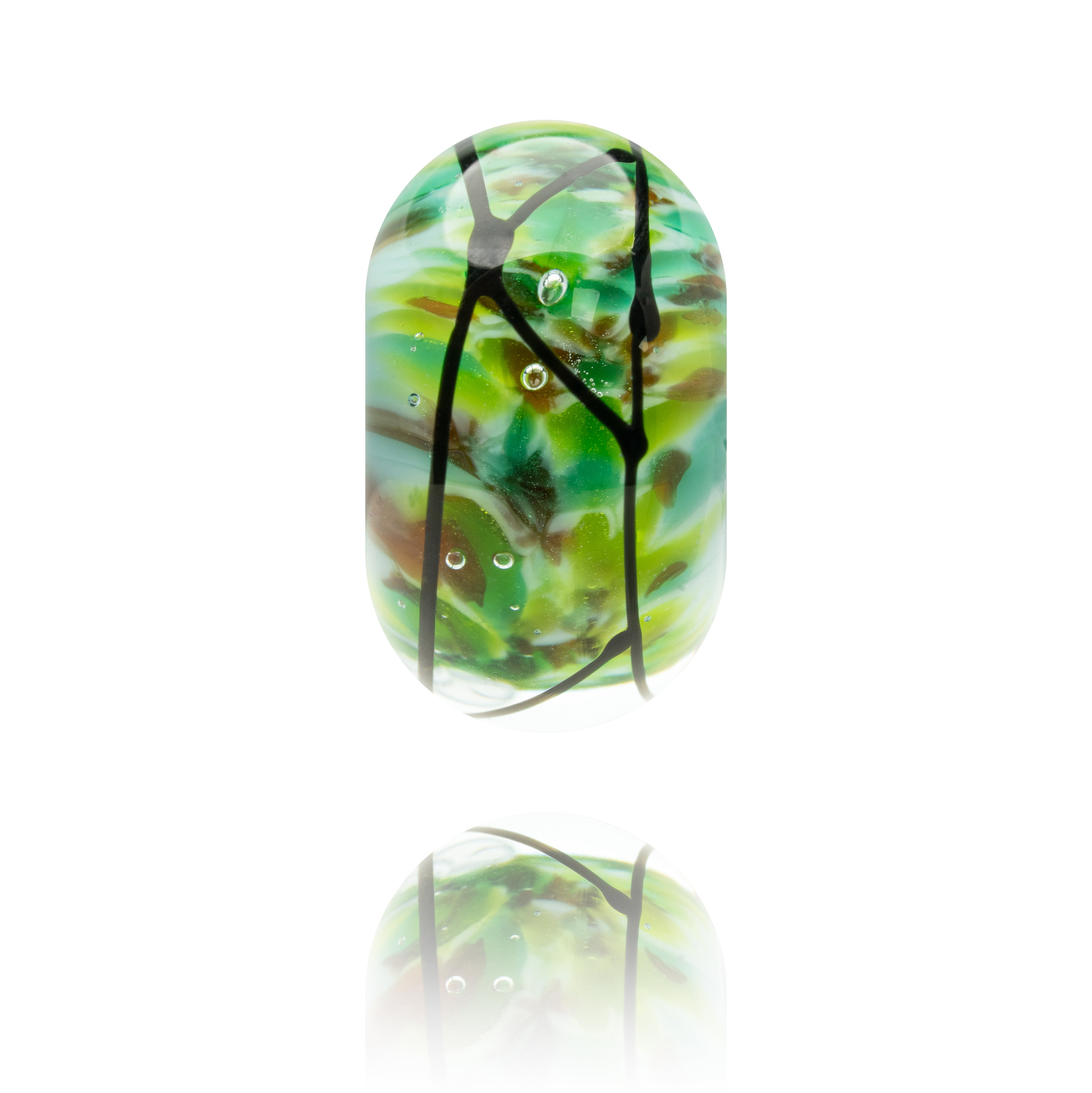 Glass pendant with green and brown design on a white background