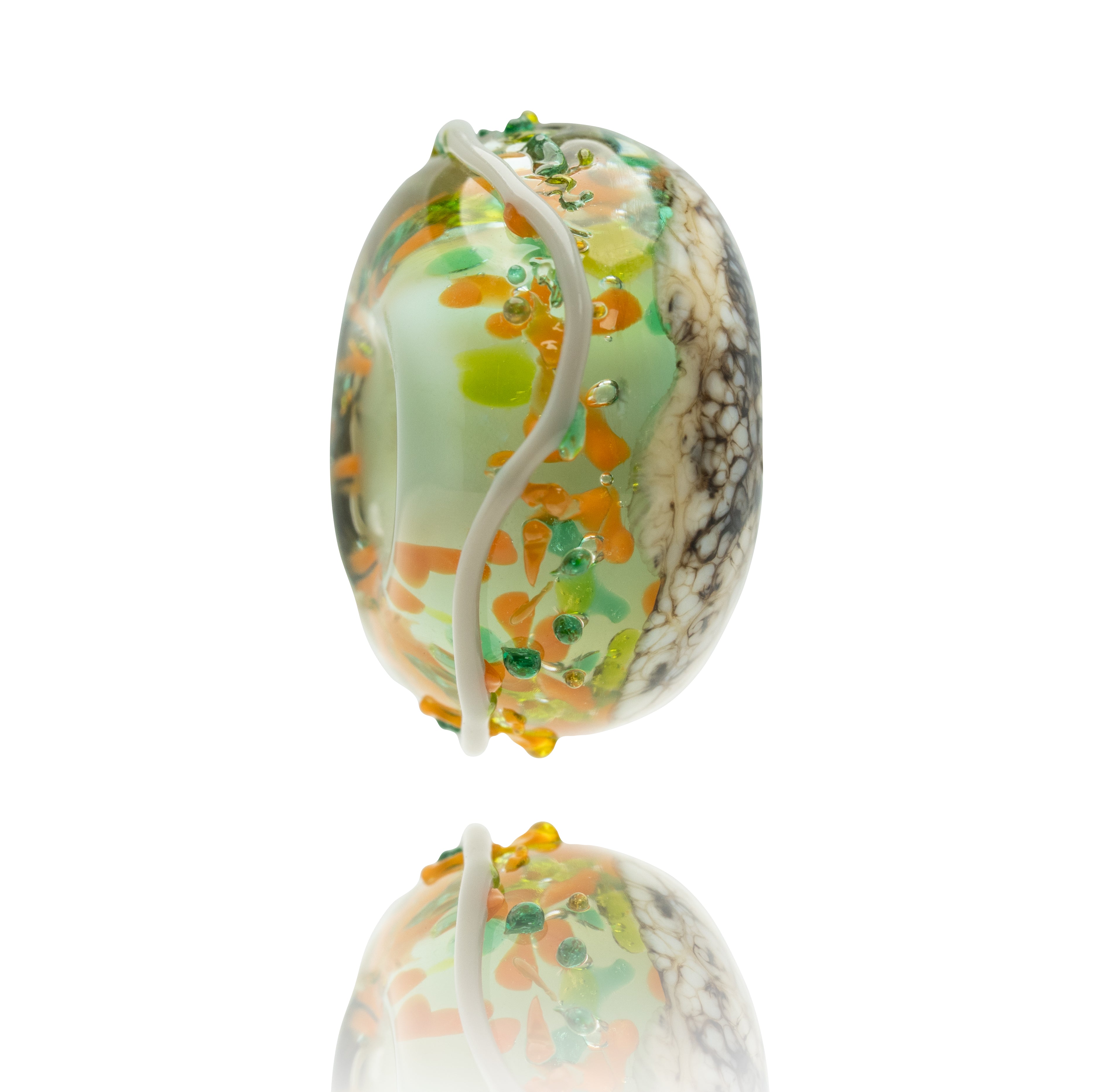 Green, brown and orange mottled glass bead with grey pattern on white background.