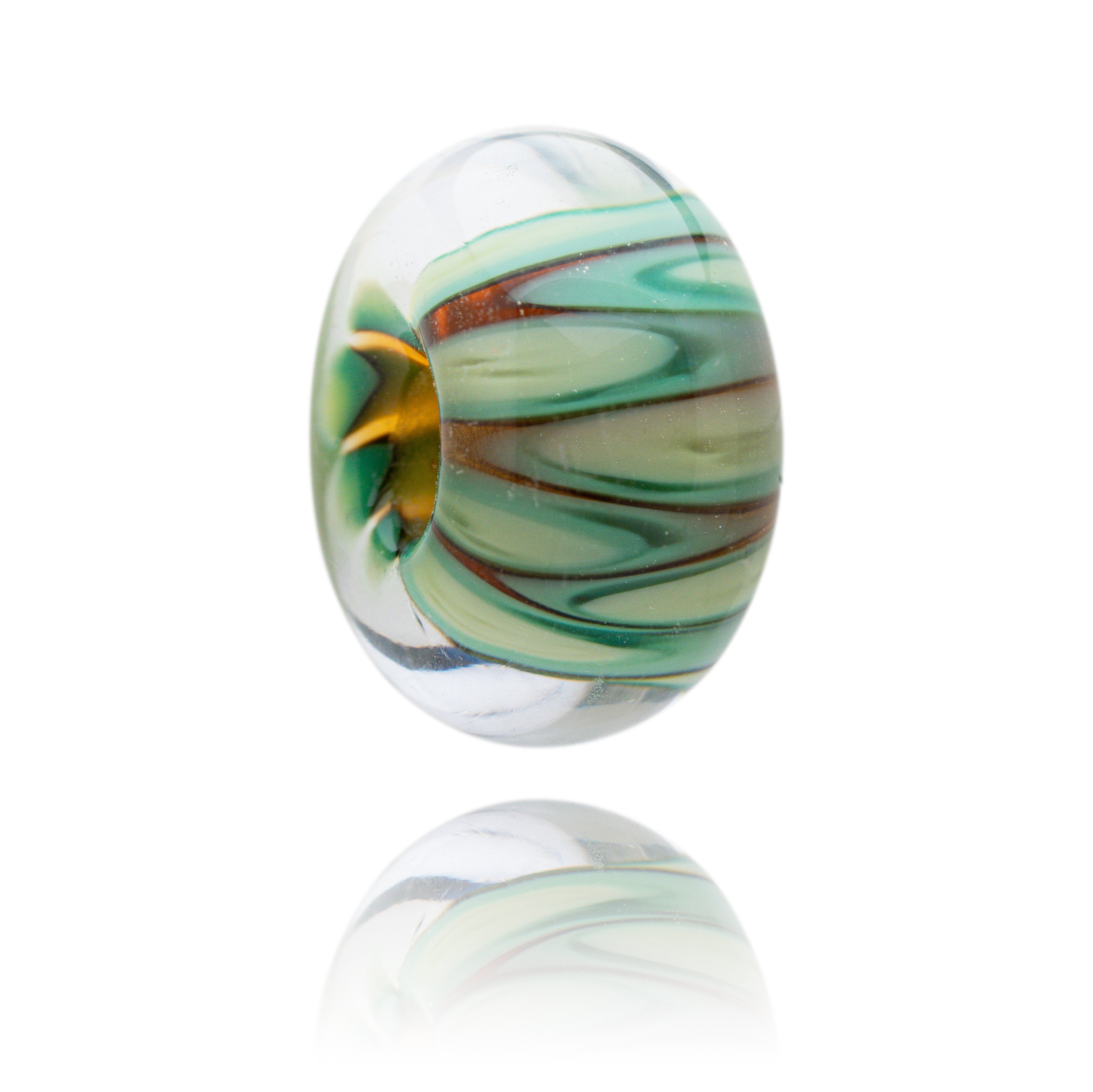Marbled glass bead with green and brown swirls on a white background