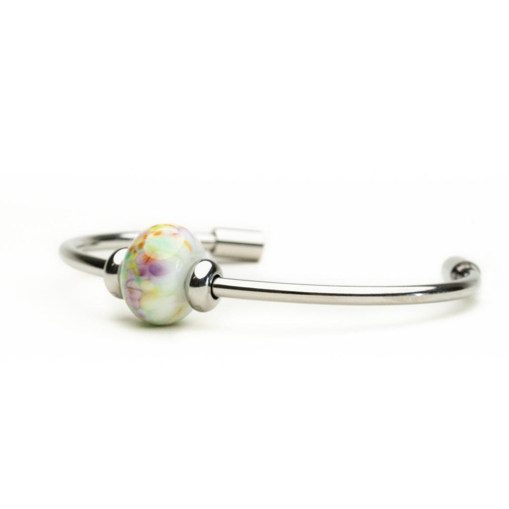 Colourful coastal spring glass bead on silver bangle.