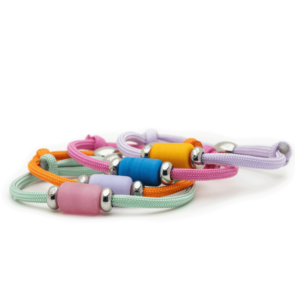 A set of colorful adjustable cord bracelets with smooth cylindrical beads and silver metal end caps, arranged on a plain white background.
