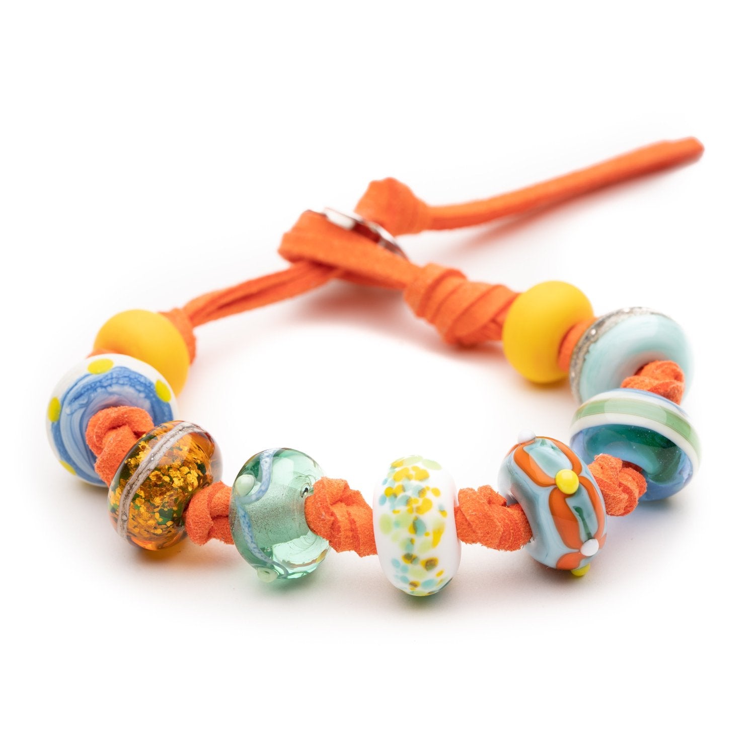 Bright coral cord bracelet with colourful green, yellow and blue glass beads representing UK beaches.