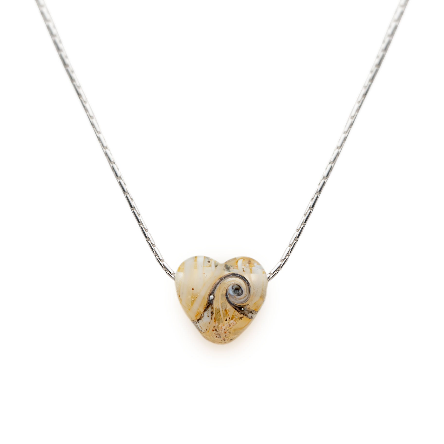 Cream glass sand heart bead on silver chain necklace.