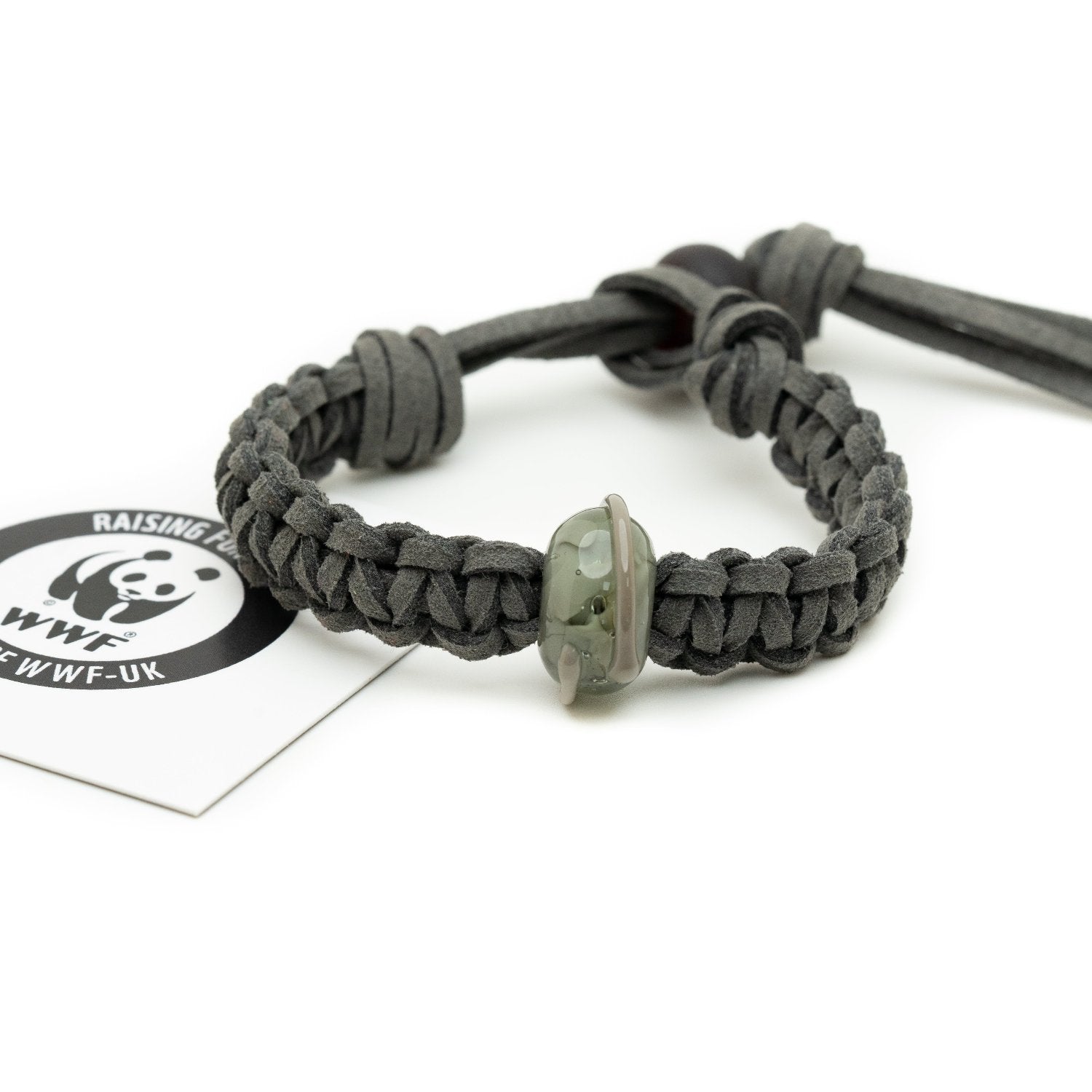 Grey glass bead on bracelet representing a elephant being sold to raise funds for the World Wildlife Foundation.