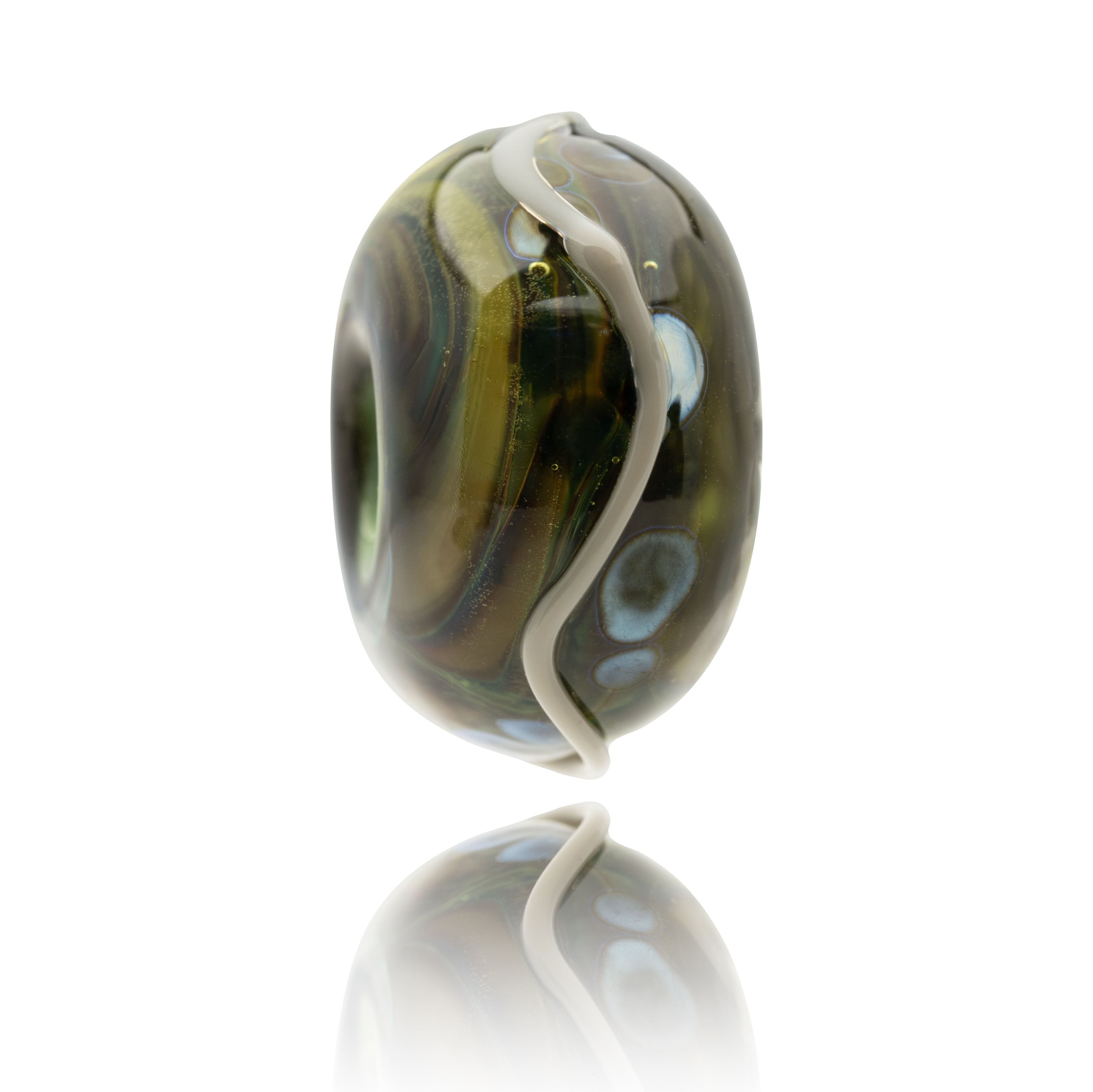 Glass bead with swirl pattern on a white background