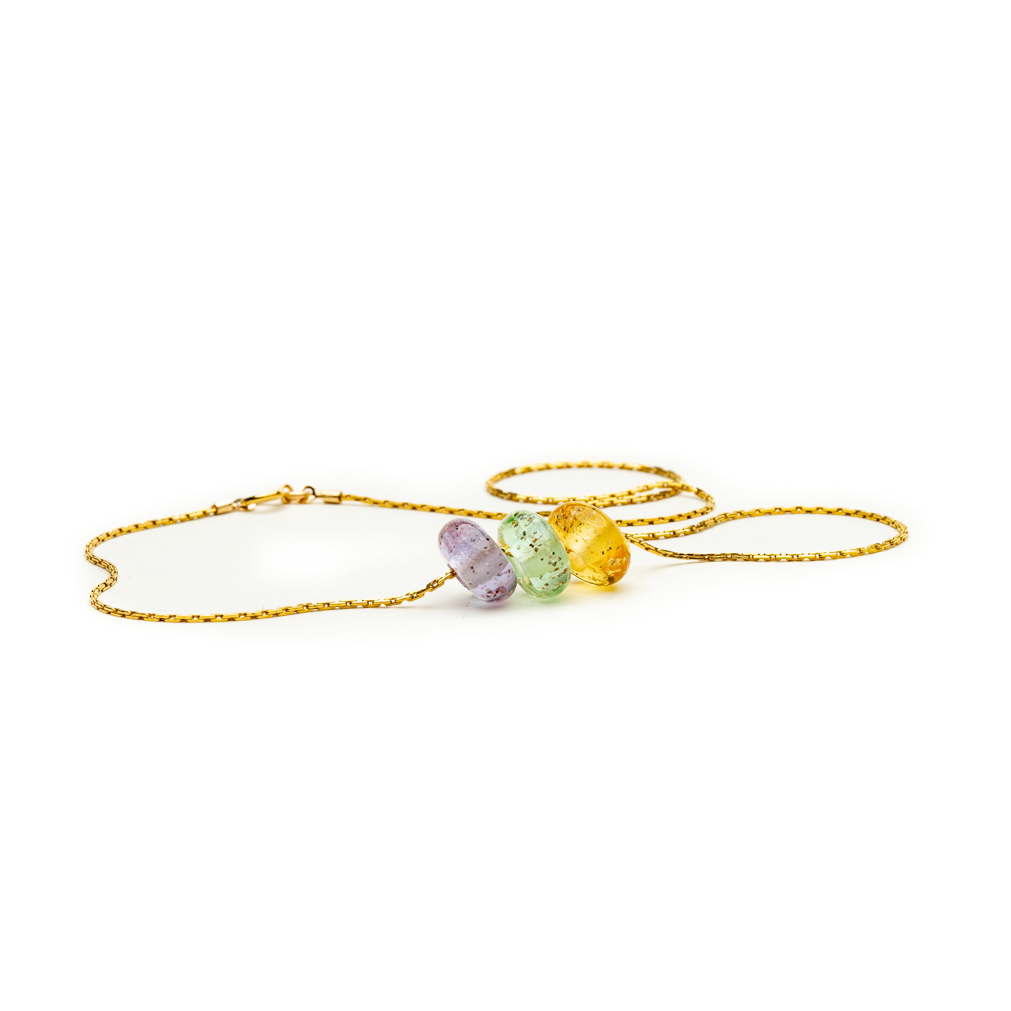 Gold fill necklace with rose, sea glass green and amber coloured glass beads with grains of sand encapsulated within the glass.