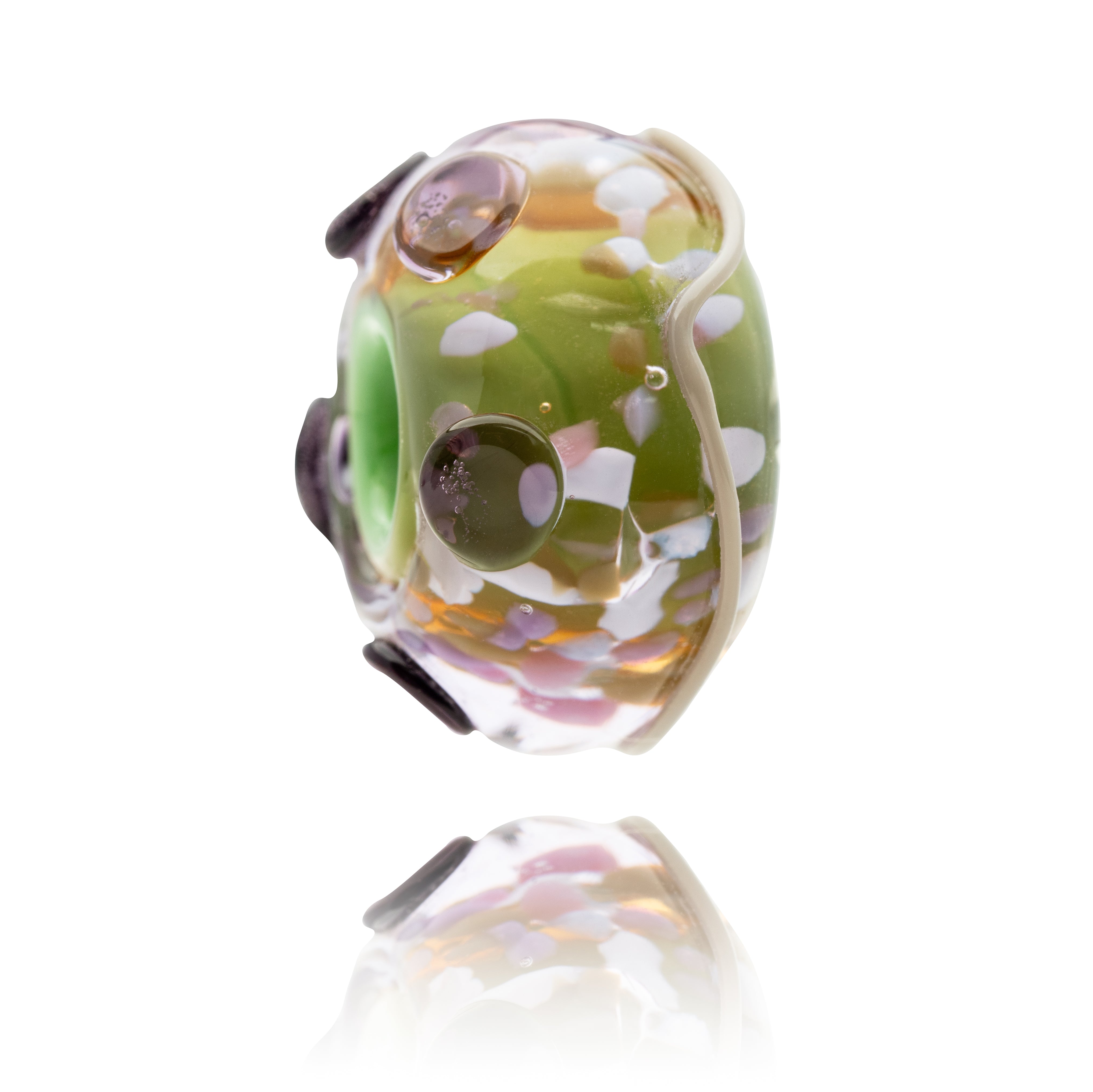 Decorative glass bead with multicolored pattern on a white background