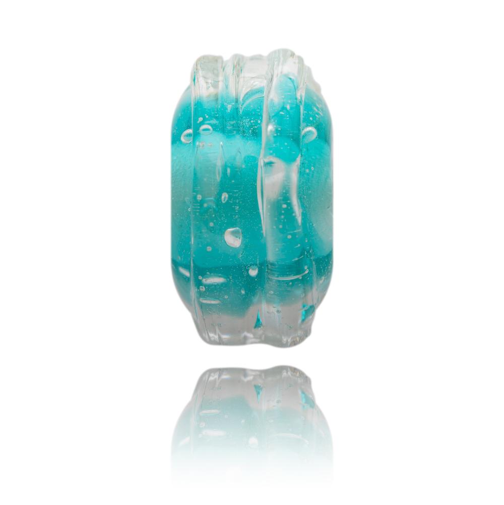 Turquoise glass bead representing Grebe Beach in Cornwall