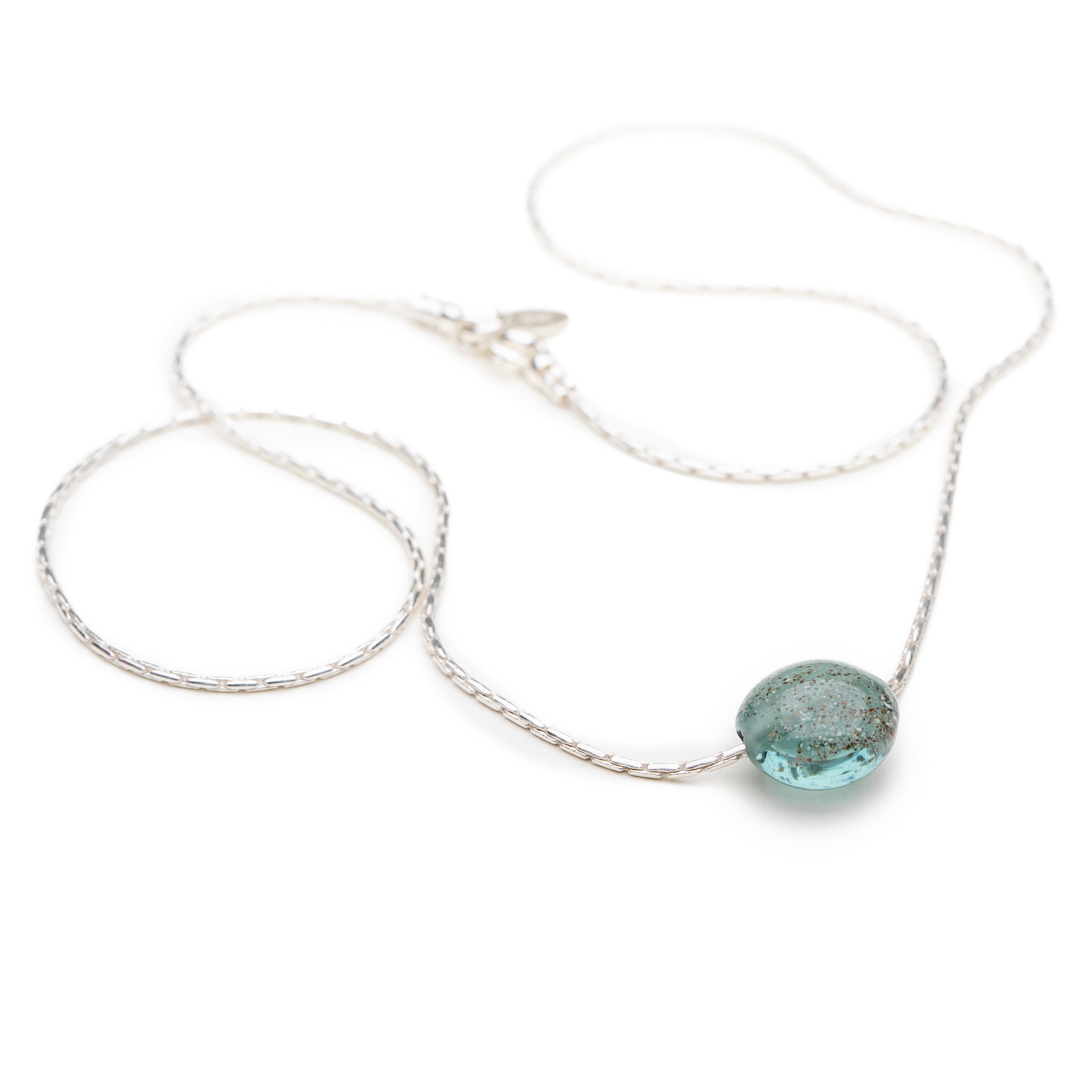 Silver chain necklace with glass bead.
